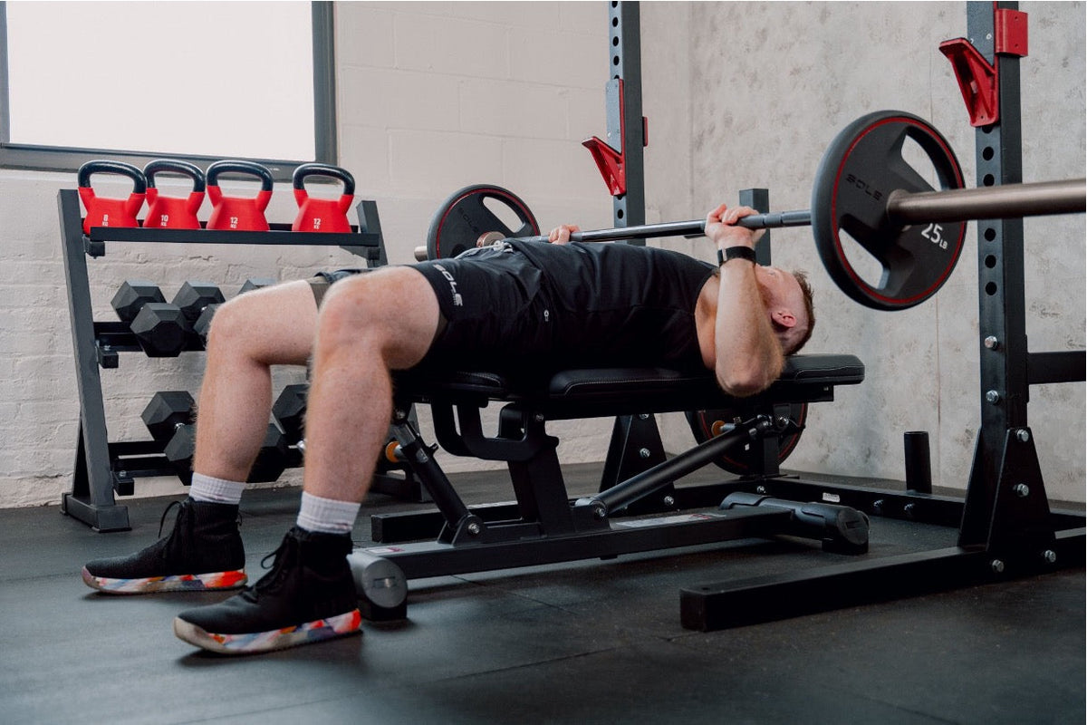 A person working out using a barbell