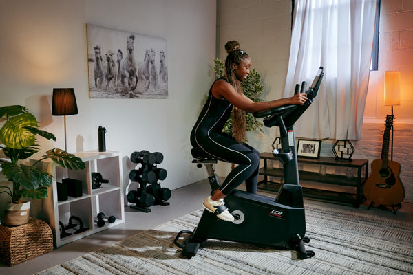 Under Desk Bike vs Stationary Bike: Differences, Benefits & How to Choose