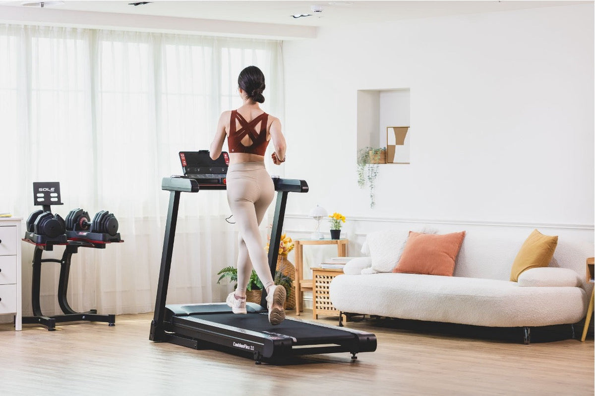 Woman using a SOLE F63 treadmill at home