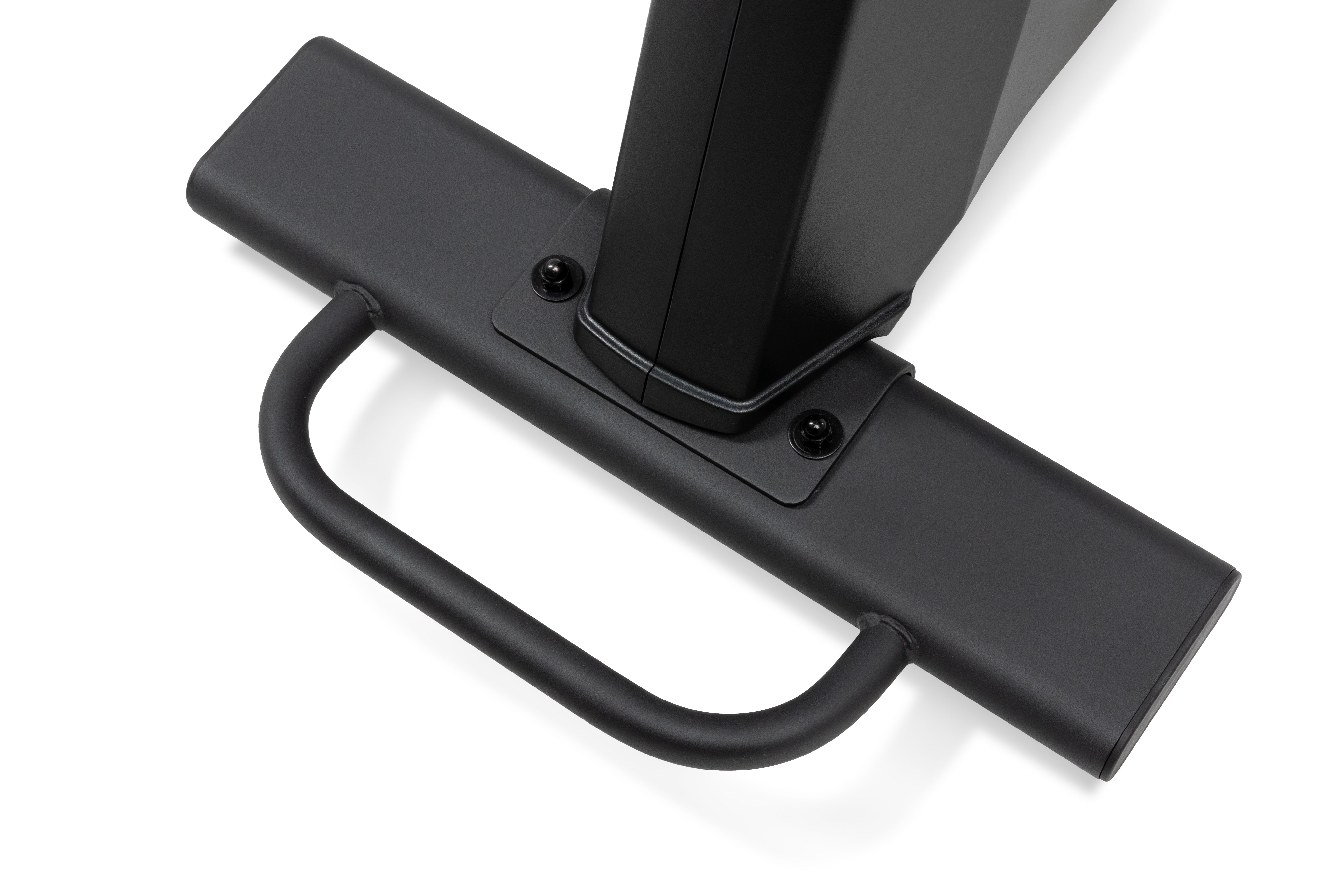 Close-up of the Sole B94 exercise machine's matte black base, featuring a sturdy handlebar and a joint connecting to the main pillar with visible screws.