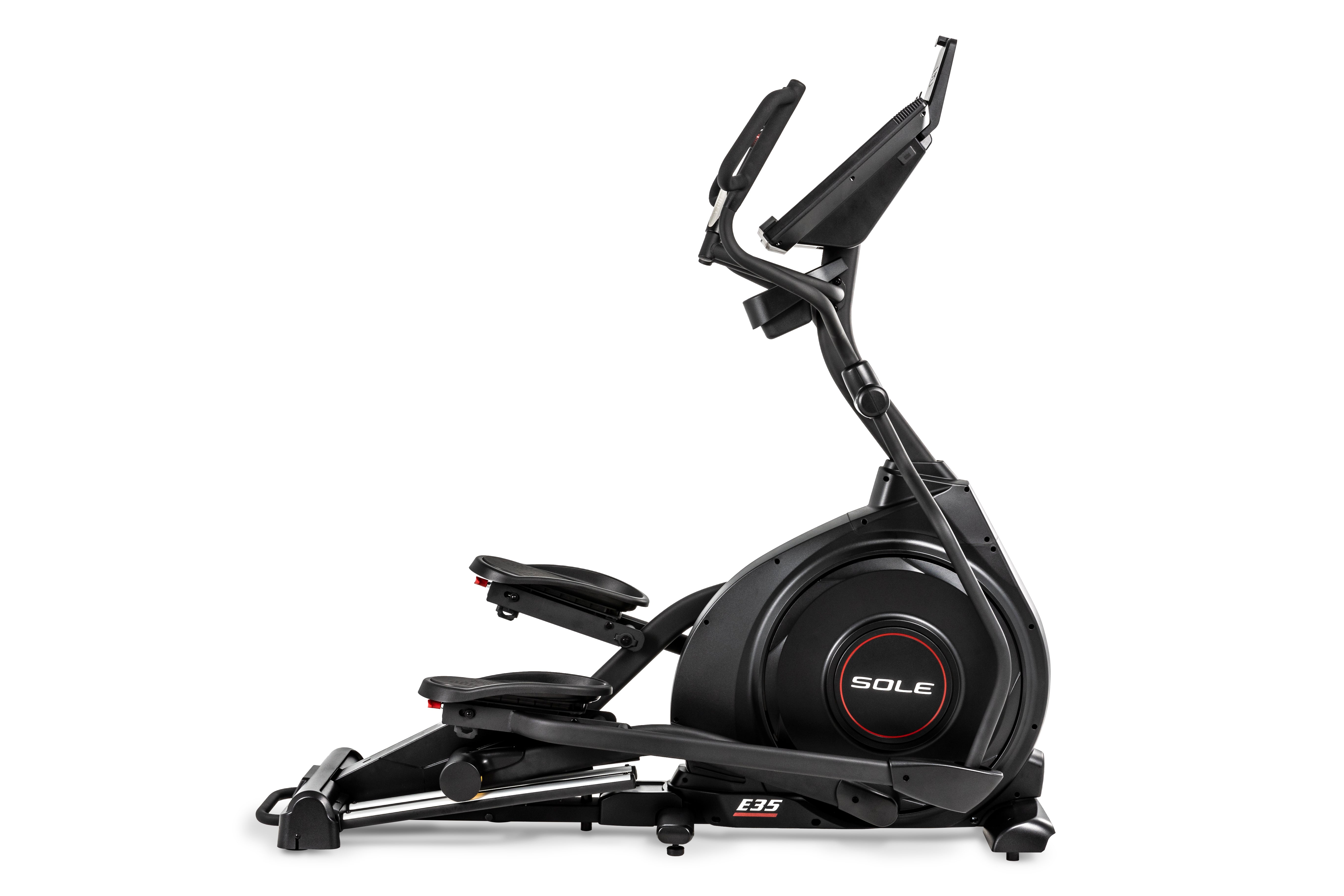 Sole E35 elliptical trainer viewed from a side angle, showcasing its sleek black design, adjustable foot pedals, 'SOLE' branding on the central flywheel, and 'E35' insignia on the lower frame.