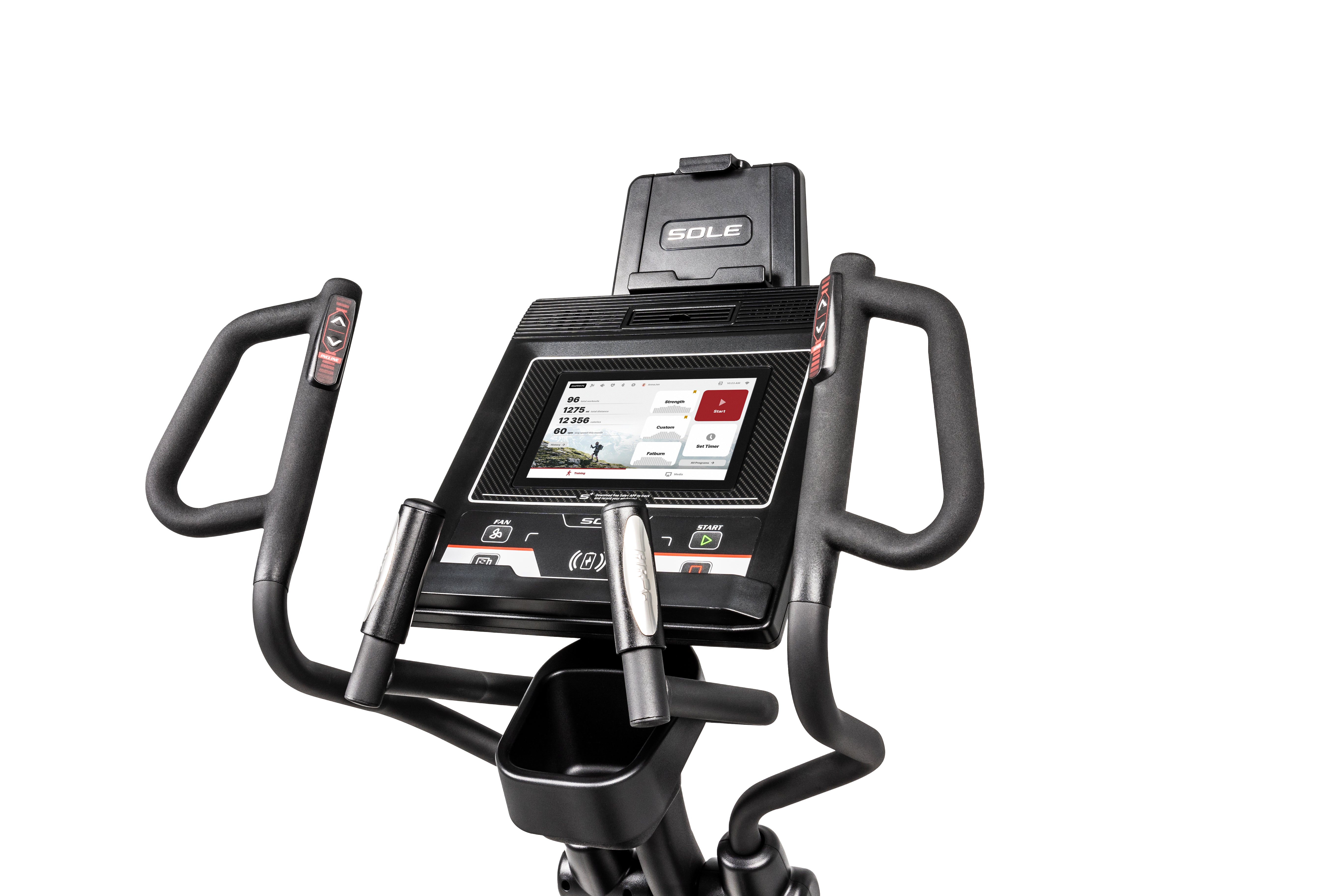 Angled close-up of the Sole E35 elliptical machine's console and handlebar area. The digital touchscreen showcases various fitness metrics on a map interface. Beneath the screen are tactile buttons, including those labeled "CAL", "SC", and "START". The machine's handlebars, one with heart rate sensors, have arrowed adjustment buttons. A cup holder is situated below the console. The design features shades of black and gray, with subtle silver and red details.