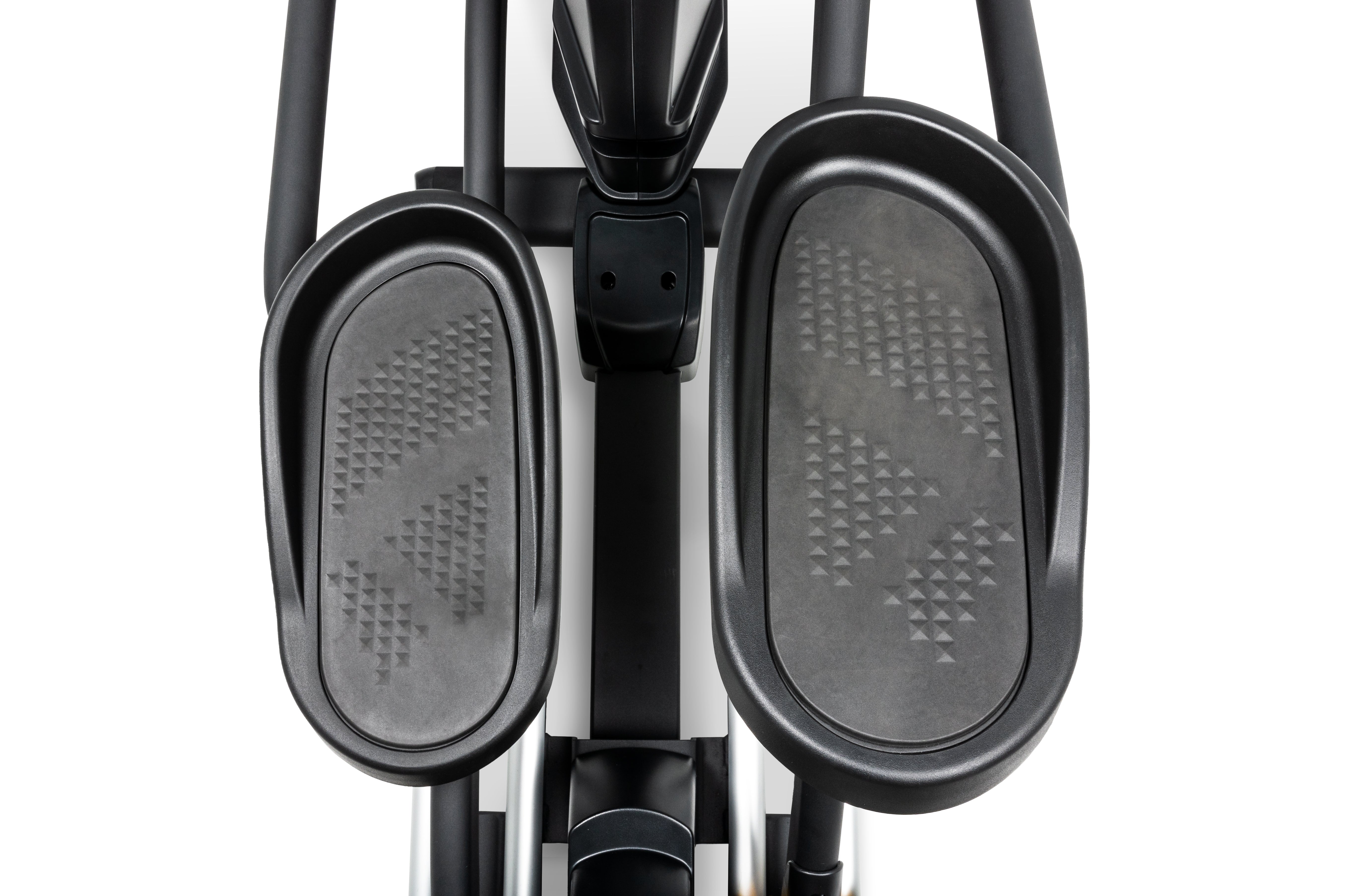 Close-up view of the Sole E95 elliptical machine's foot pedals, showcasing their textured, non-slip surface and the sturdy frame connecting them to the main unit.