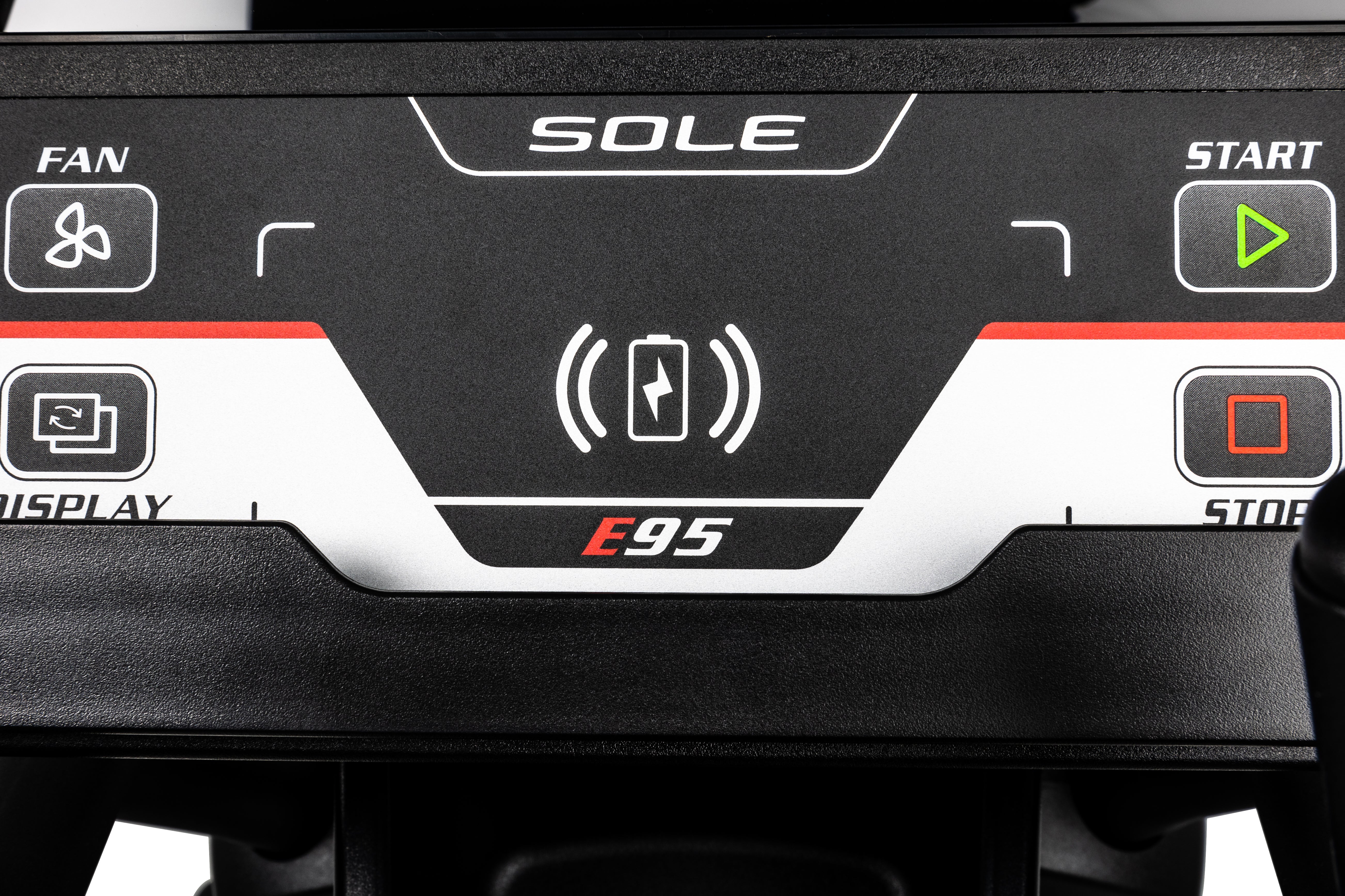 Zoomed-in view of the Sole E95 elliptical machine's control panel, displaying buttons labeled 'FAN', 'DISPLAY', and 'START', along with the 'E95' branding and a battery icon.