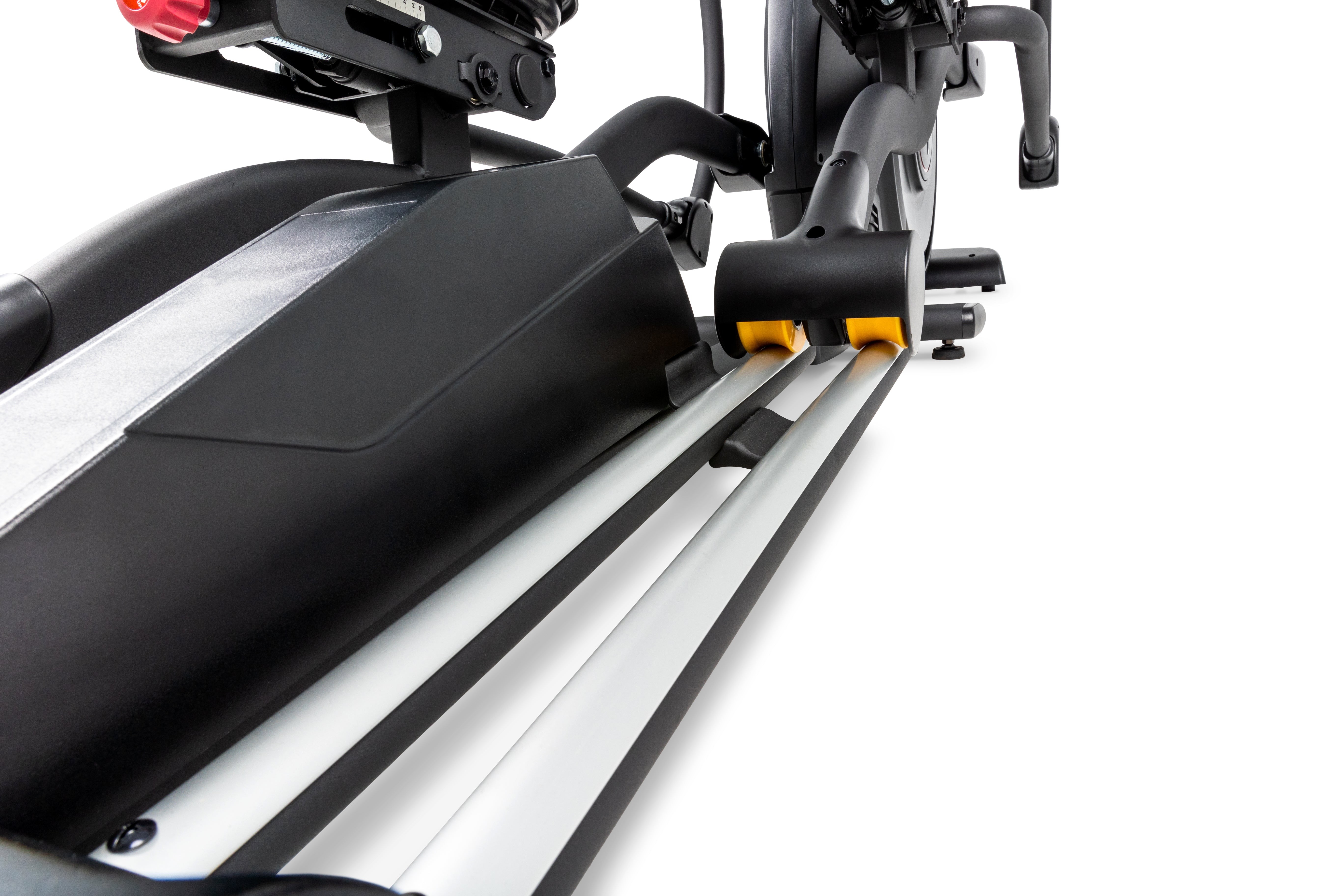 Close-up view of the Sole E95 elliptical machine showcasing its sleek black body, silver track rails, and prominent yellow roller wheels, with the handle grip and adjustment components in the background.