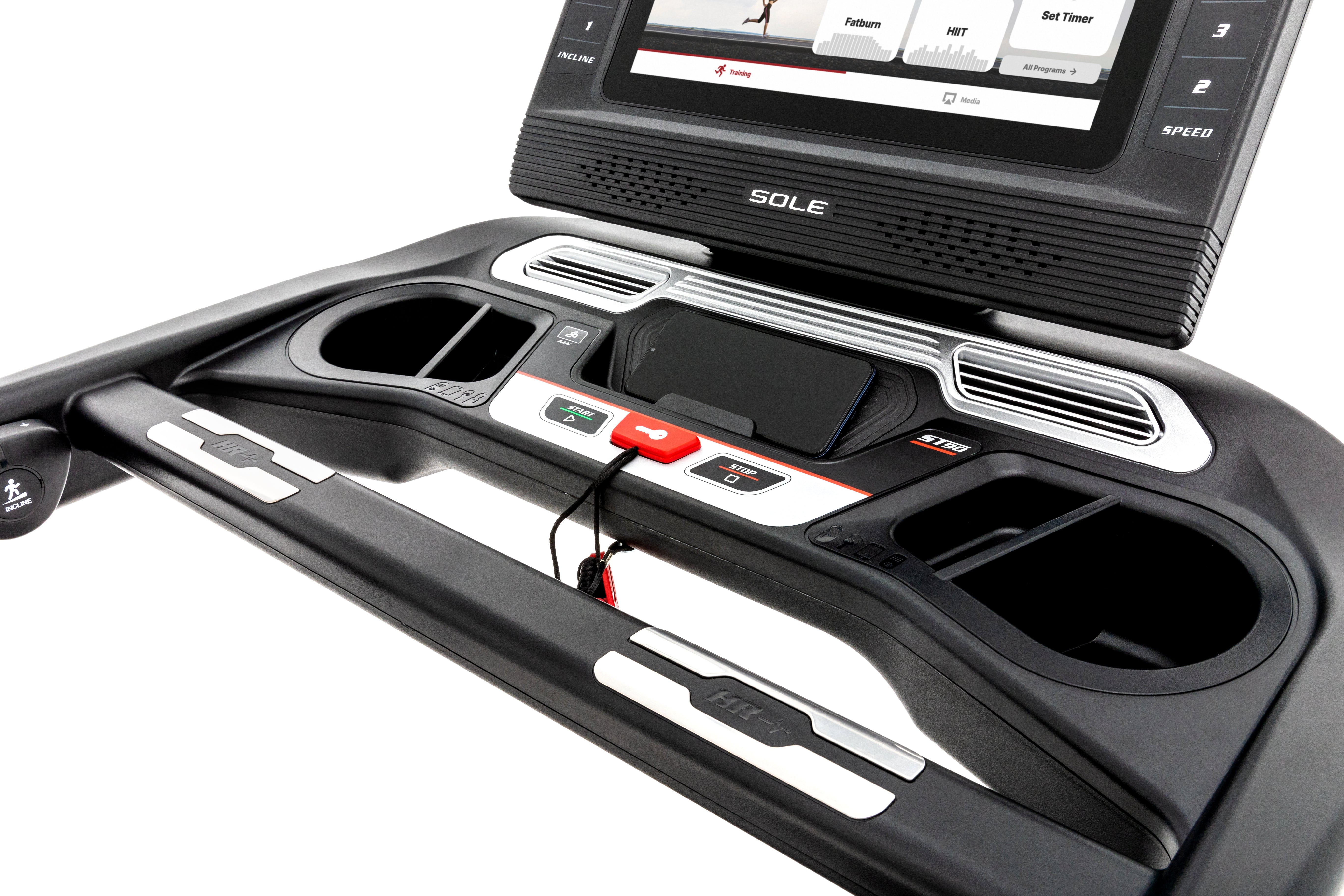 Angled view of the Sole ST90 treadmill's control panel, featuring a digital screen displaying a running feedback, tactile start and stop buttons, cup holders, and the safety key attachment on a sleek black design with silver accents.
