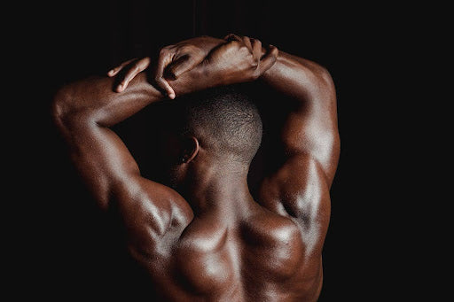 Close-up of a muscular back, highlighting shoulder muscles.
