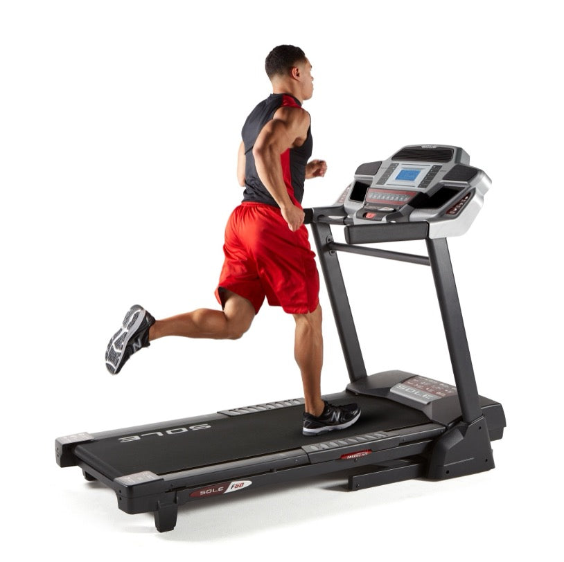 Runner on a home treadmill, where belt friction builds the static charge that causes shocks