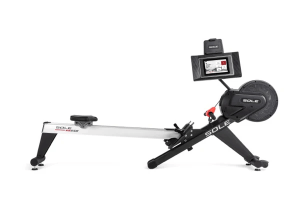 Side view of the SOLE SR550 rowing machine showcasing its sturdy aluminum frame and 10.1-inch touchscreen display.
