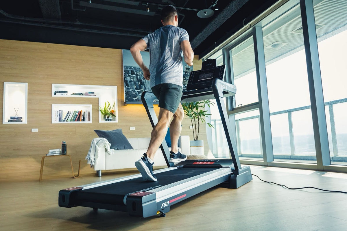 Man using a SOLE F80 treadmill