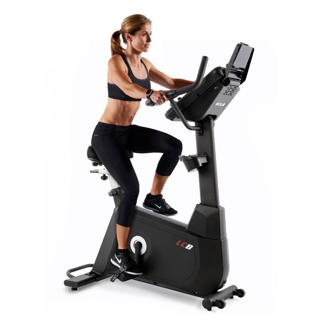 Arm, Shoulder, Leg, Exercise machine, Indoor cycling, Knee, Thigh, Stationary bicycle, Sneakers, Elbow