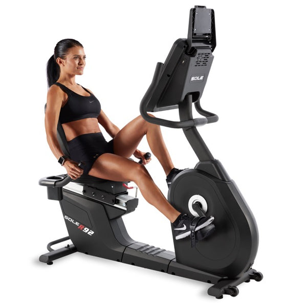 a woman on an exercise bike