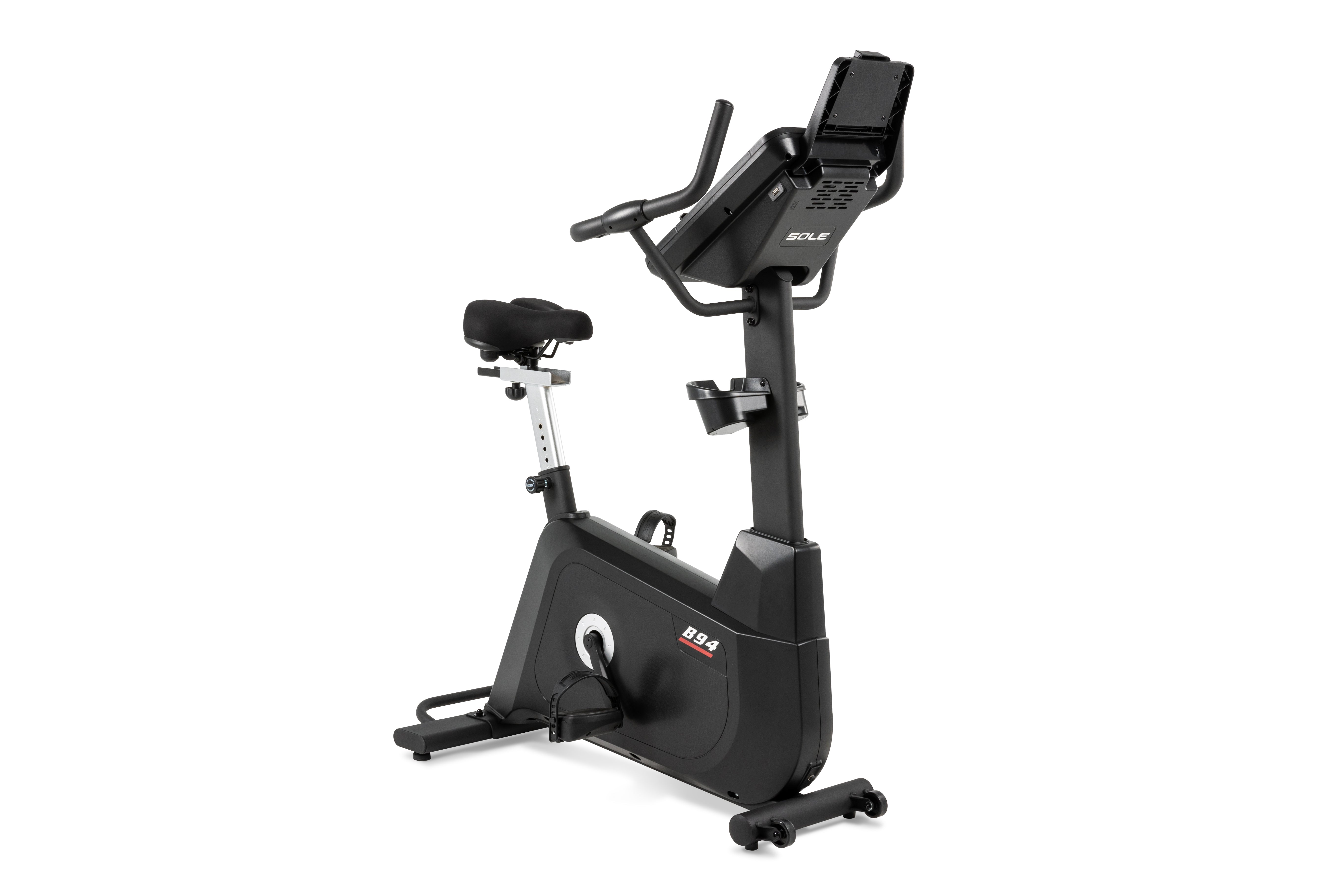 Sole B94 upright exercise bike with a prominent digital console, adjustable black seat, and sturdy frame.