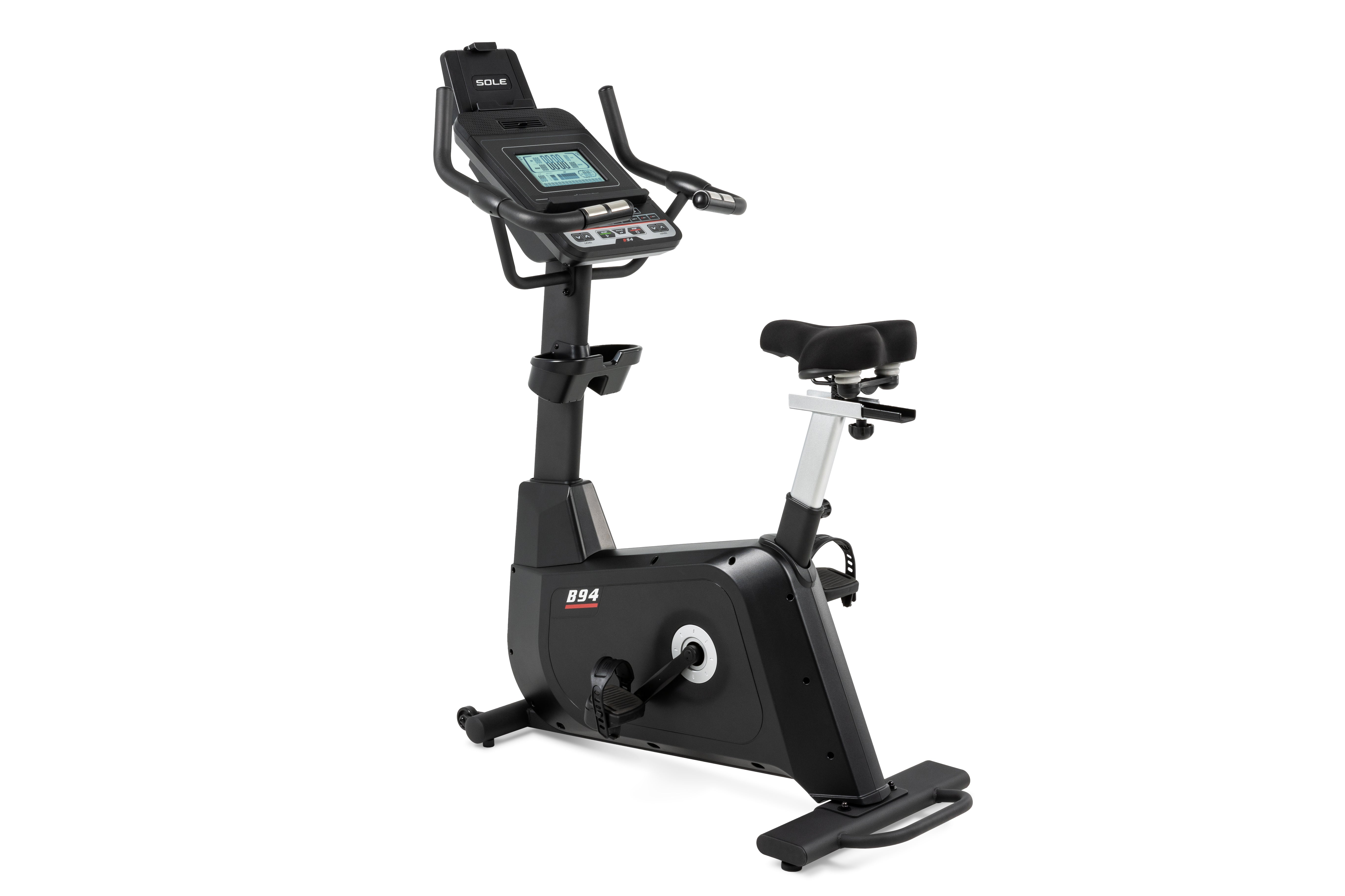 Sole B94 stationary bike featuring an advanced digital console with multiple buttons, ergonomic handlebars, an adjustable padded seat, and a solid frame with the B94 branding on the side.
