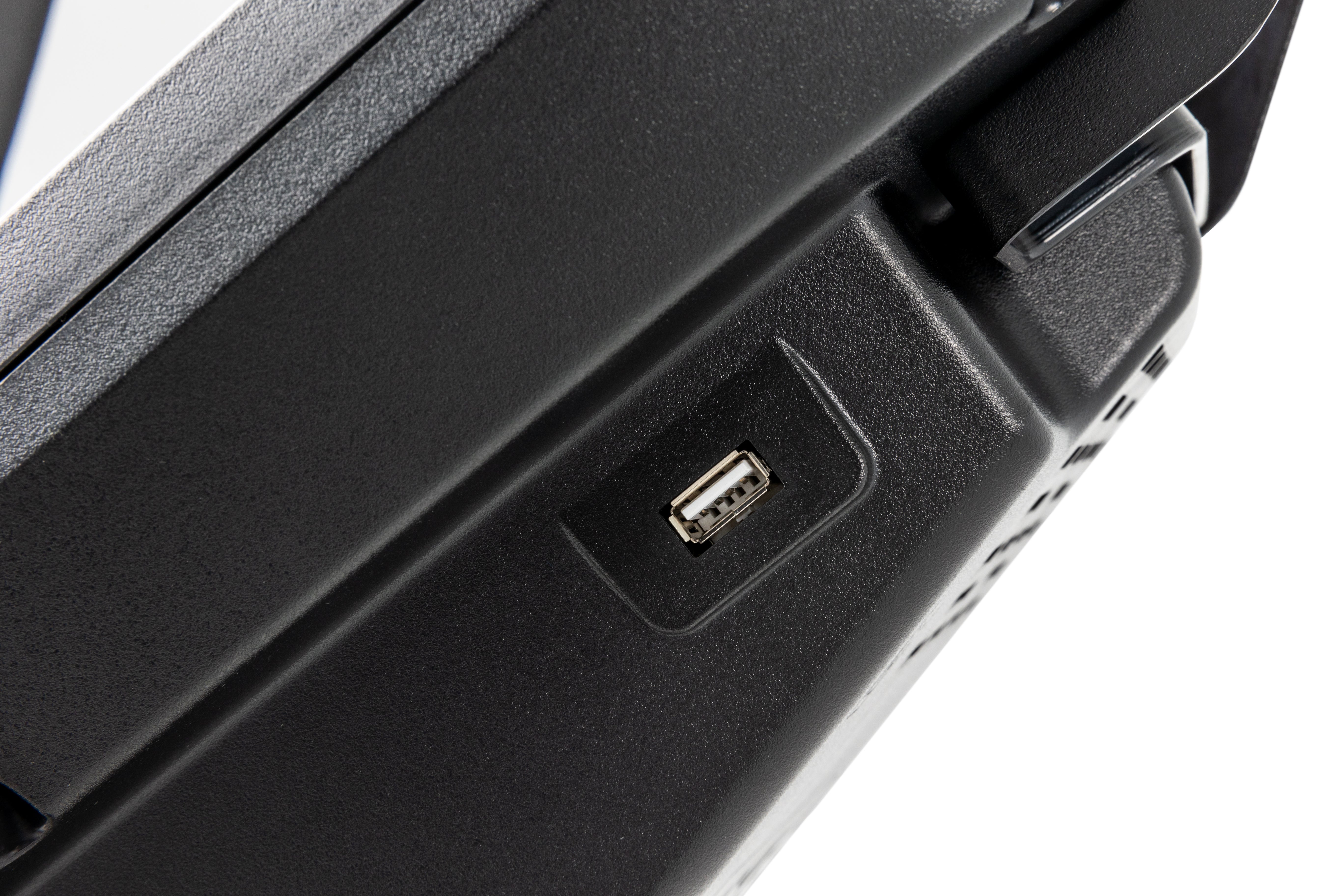Close-up of the side panel of the Sole B94, showcasing a USB port embedded in a textured black surface with subtle design details.