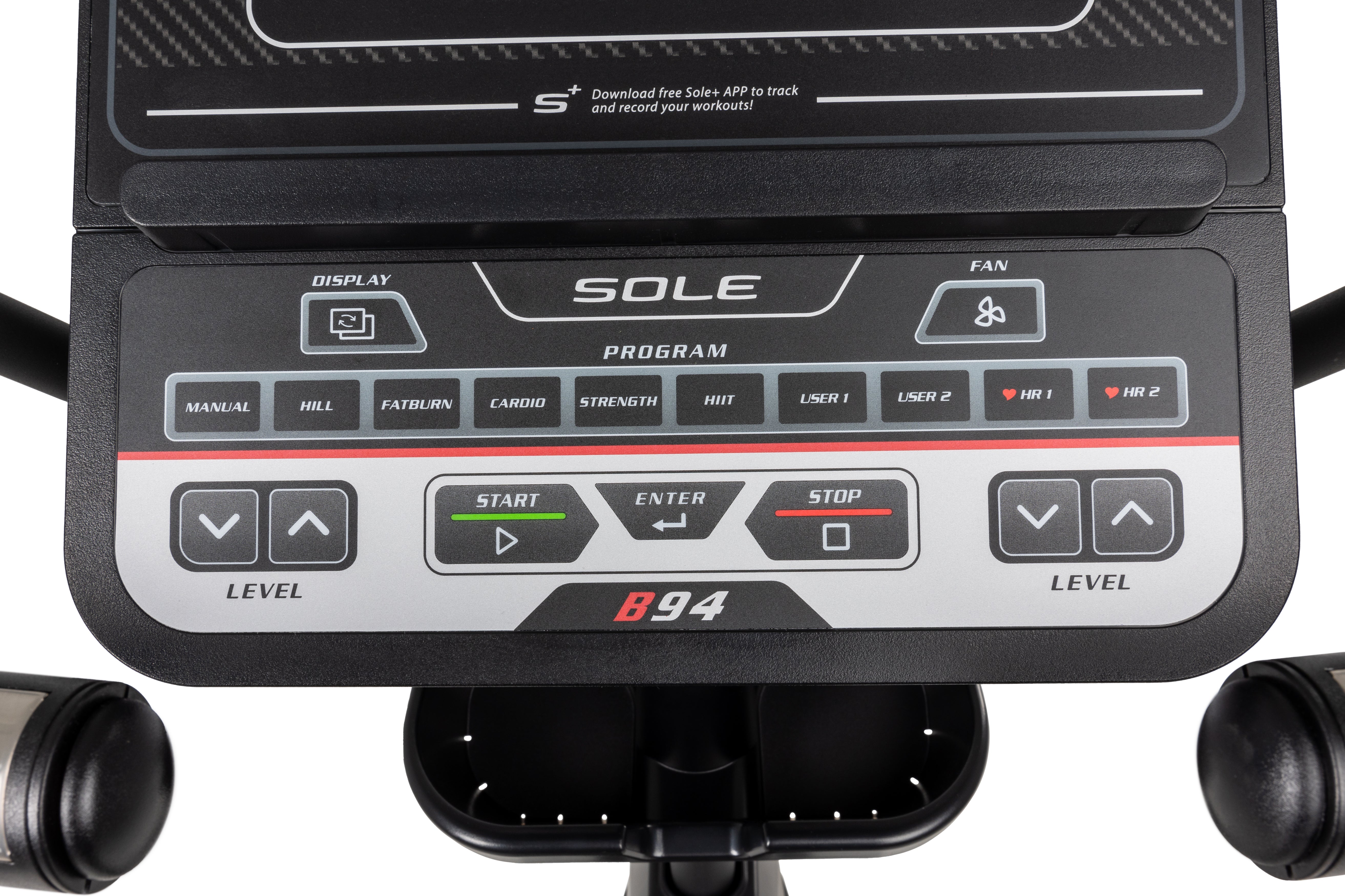 Close-up view of the Sole B94 exercise machine's control panel featuring labeled buttons for various workout programs, a digital screen prompt to download the Sole app, and adjustment controls for resistance levels, with handlebars and a cup holder visible below.