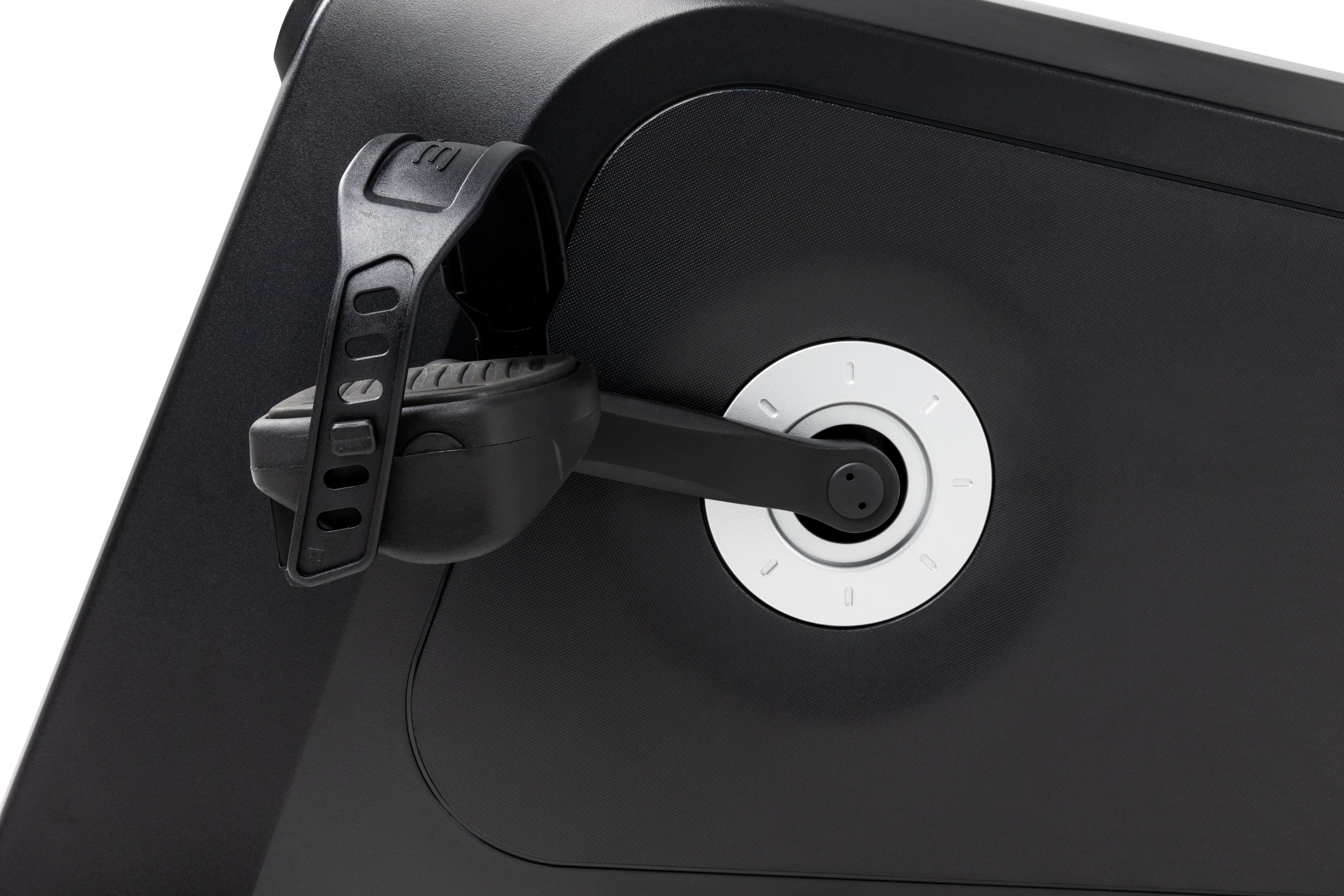 Detail view of the Sole B94 exercise bike's resistance knob with numbered settings, situated next to the pedal crank and textured pedal.