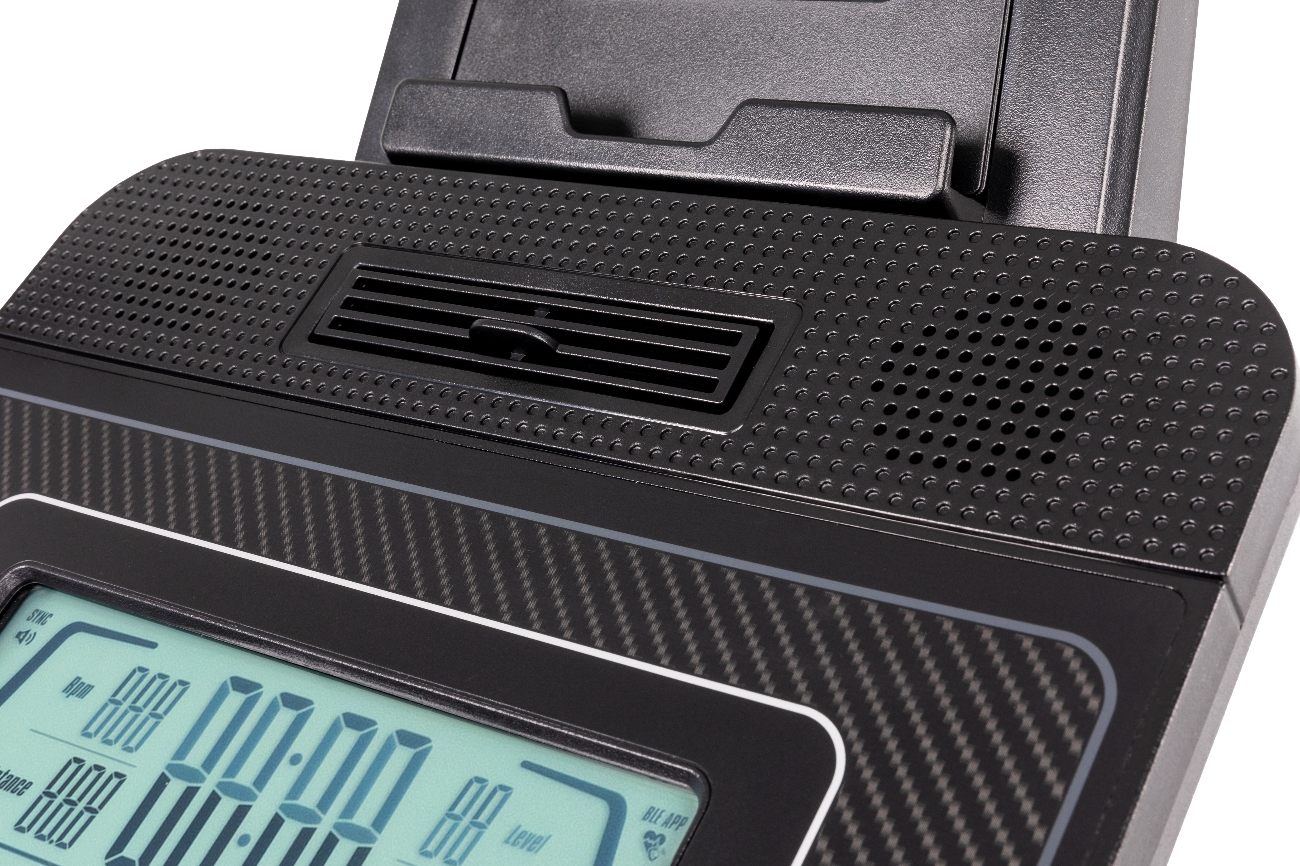 Close-up of the Sole B94 exercise bike's console, featuring the embossed 'SOLE' branding, a textured surface, a ventilation slot, and a digital display showing workout metrics.