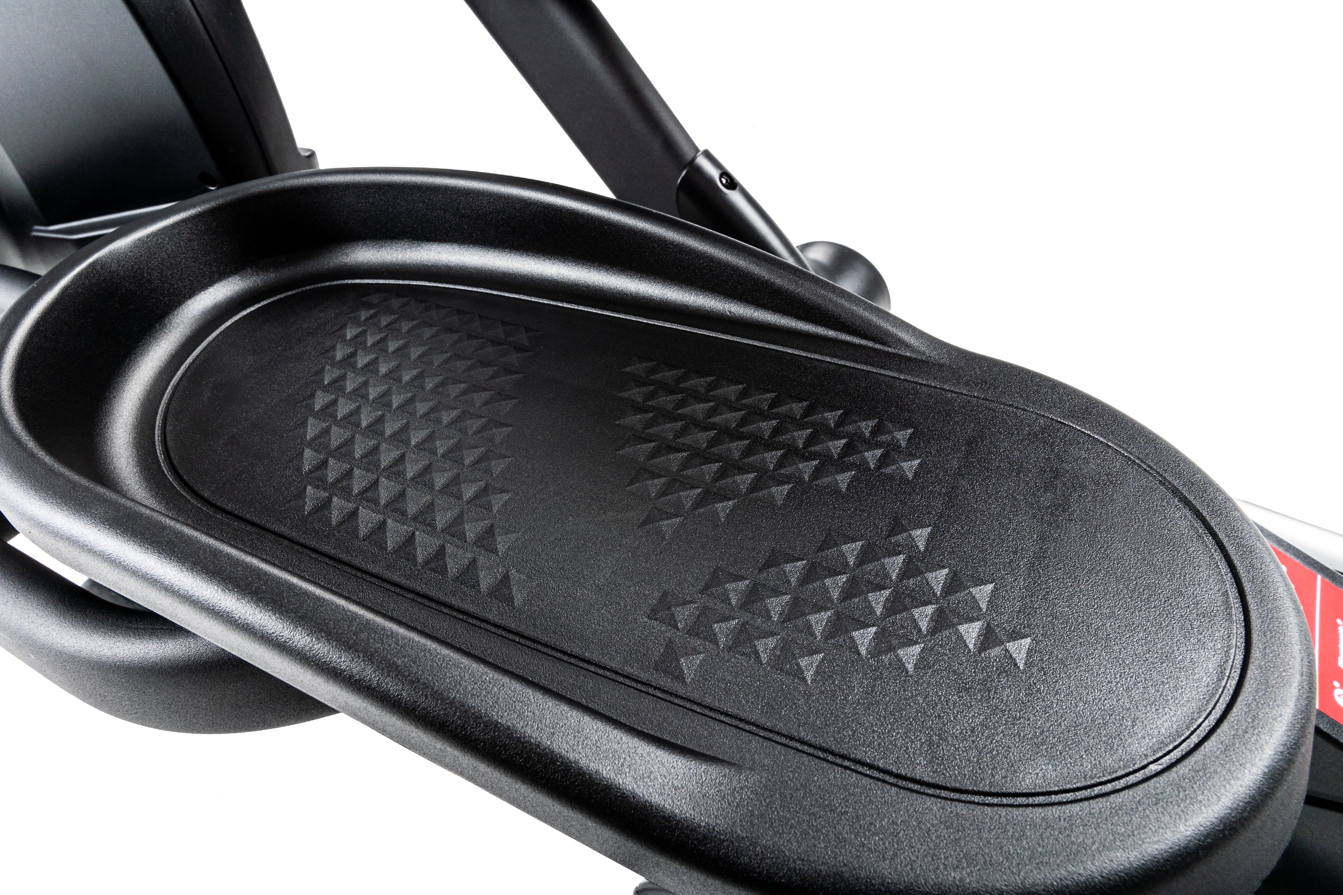 Close-up view of the Sole E25 elliptical's textured foot pedal, showcasing its black finish and geometric grip pattern for traction.