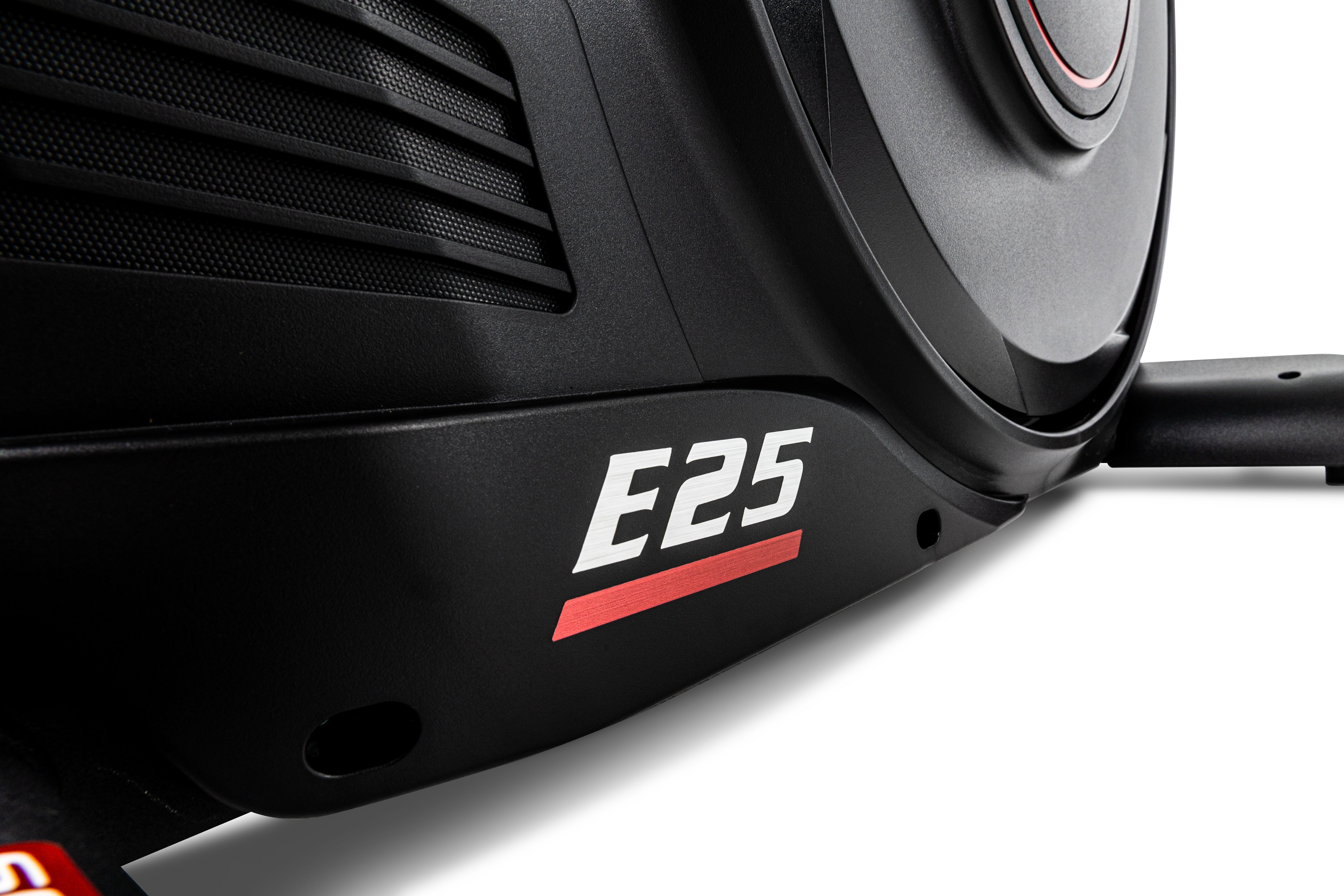Close-up view of the Sole E25 elliptical's side panel showcasing its black and gray design, vented details, and prominently displayed 'E25' branding in white and red.