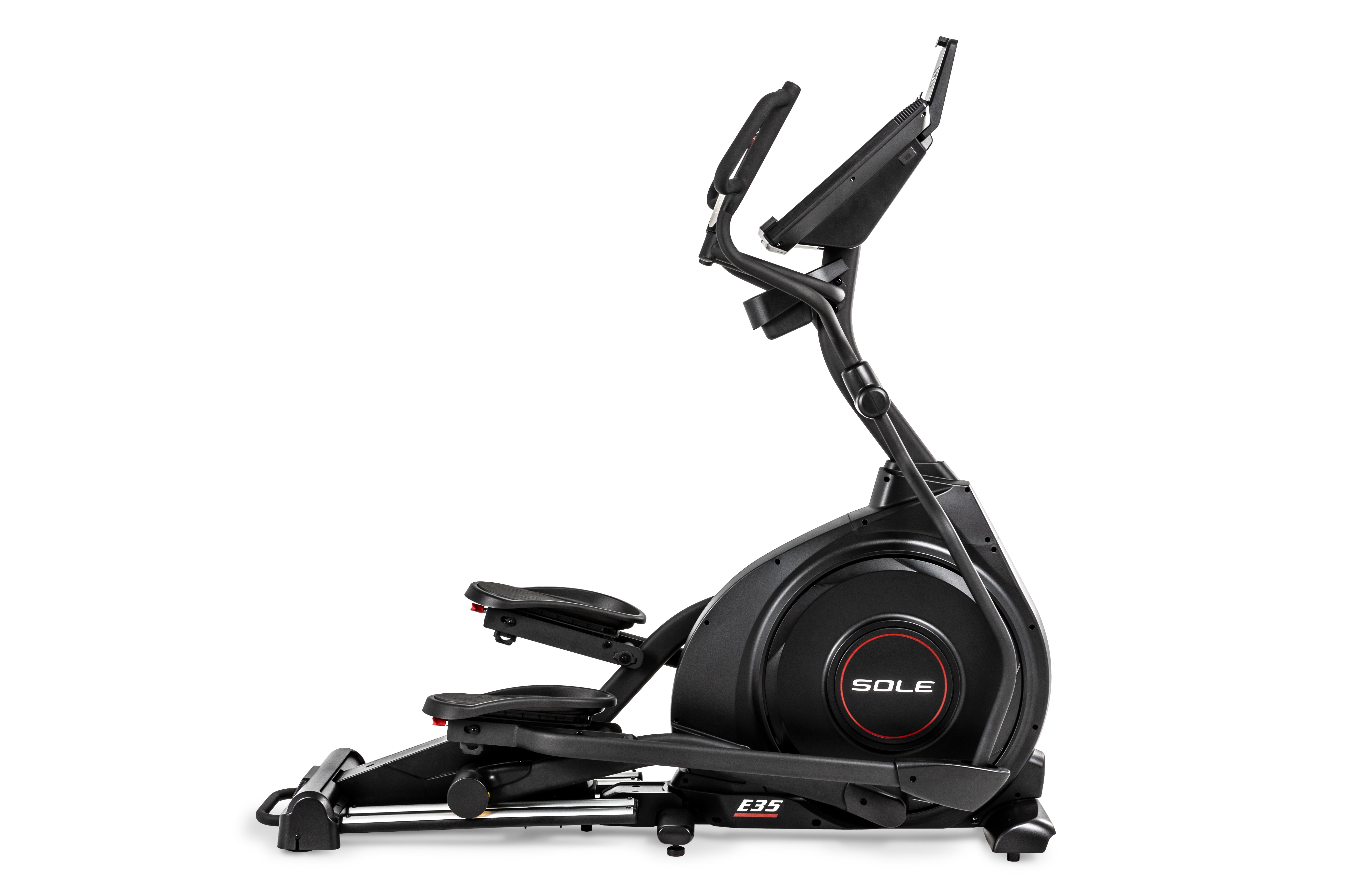 Sole E35 elliptical trainer viewed from a side angle, showcasing its sleek black design, adjustable foot pedals, 'SOLE' branding on the central flywheel, and 'E35' insignia on the lower frame.