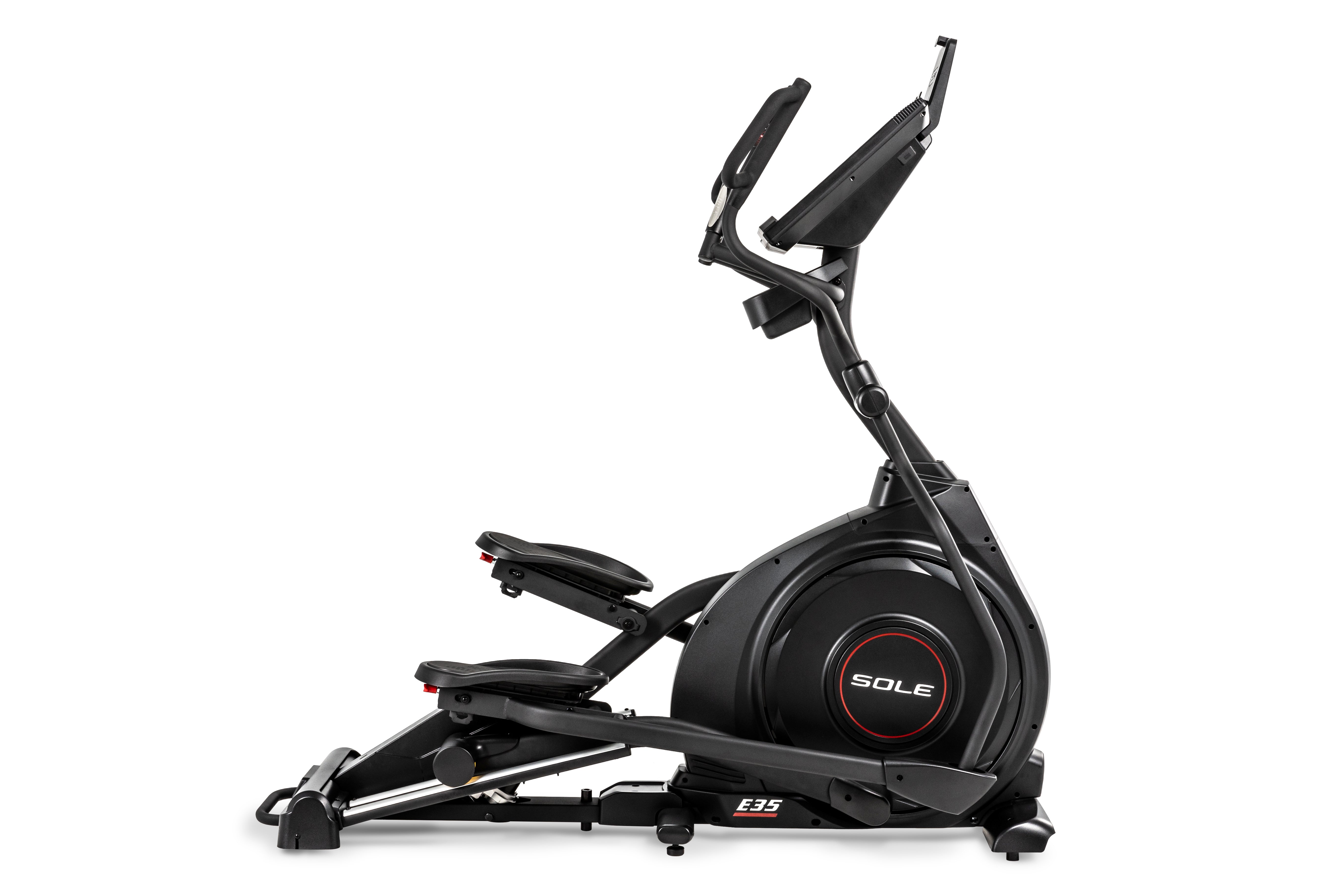 Sole E35 elliptical trainer viewed from a side angle, showcasing its sleek black design, adjustable foot pedals, 'SOLE' branding on the central flywheel, and 'E35' insignia on the lower frame.