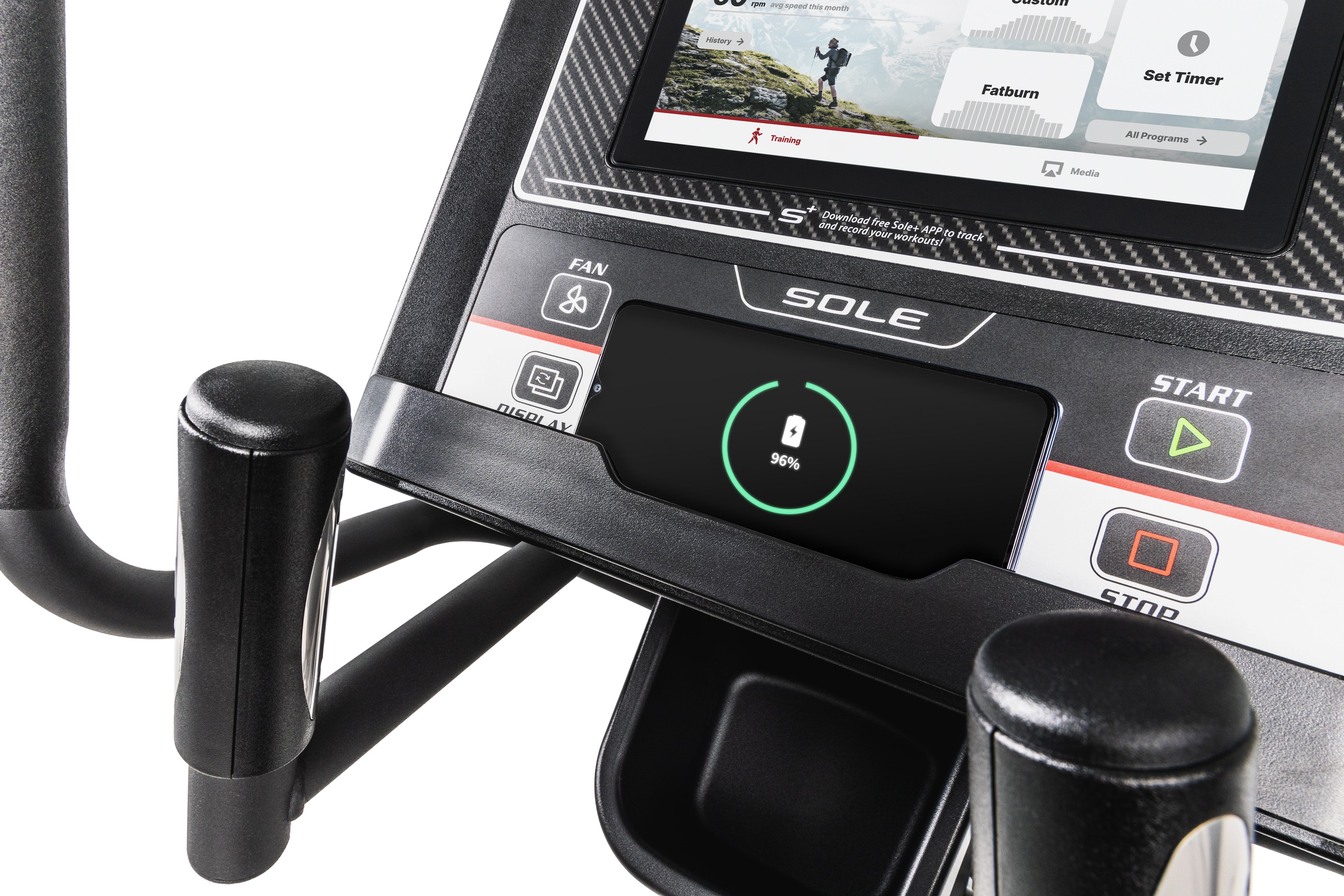 Front view of the Sole E35 elliptical machine with emphasis on its LCD display, ergonomically designed handlebars, and stable foot pedals.