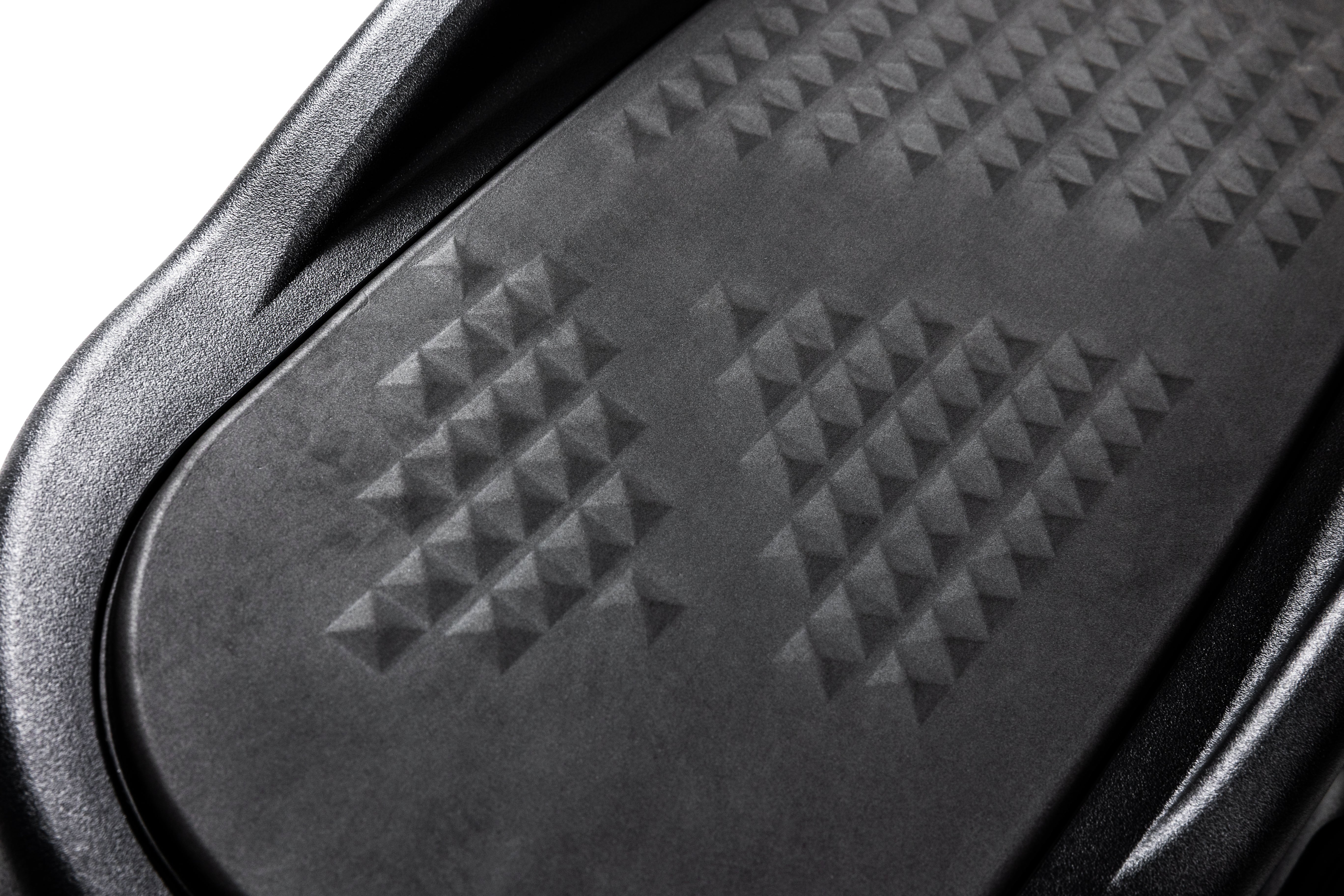 Close-up of the textured pattern on the foot pedal of the Sole E35 elliptical trainer with its smooth edge detailing