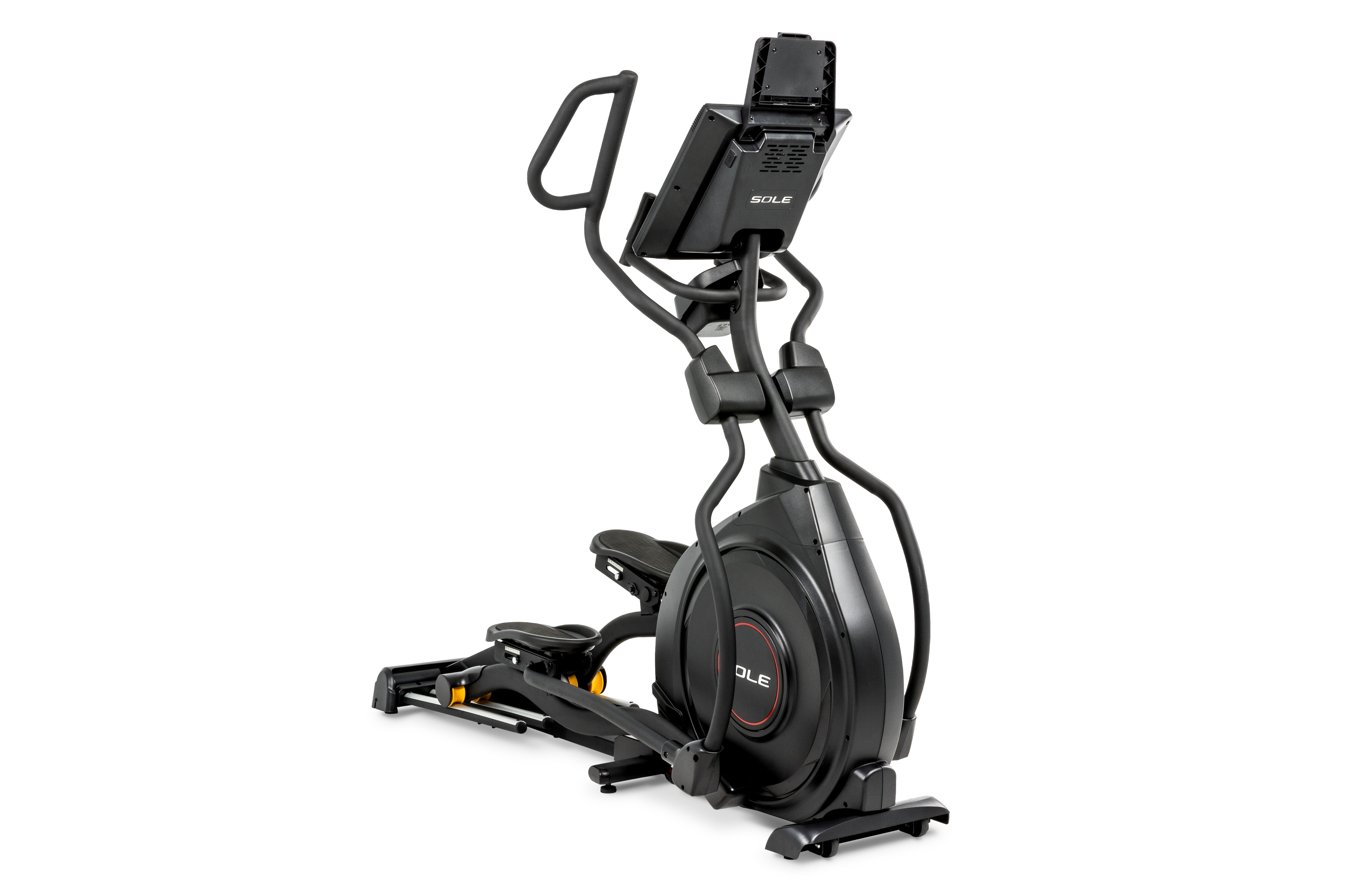Close-up view of the Sole E95 elliptical trainer, showcasing its sturdy black frame, ergonomic handlebars, and digital console. The flywheel housing has the 'SOLE' branding prominently displayed. The machine is equipped with adjustable foot pedals, a yellow safety mechanism, and a mounted tablet holder on top of the console.