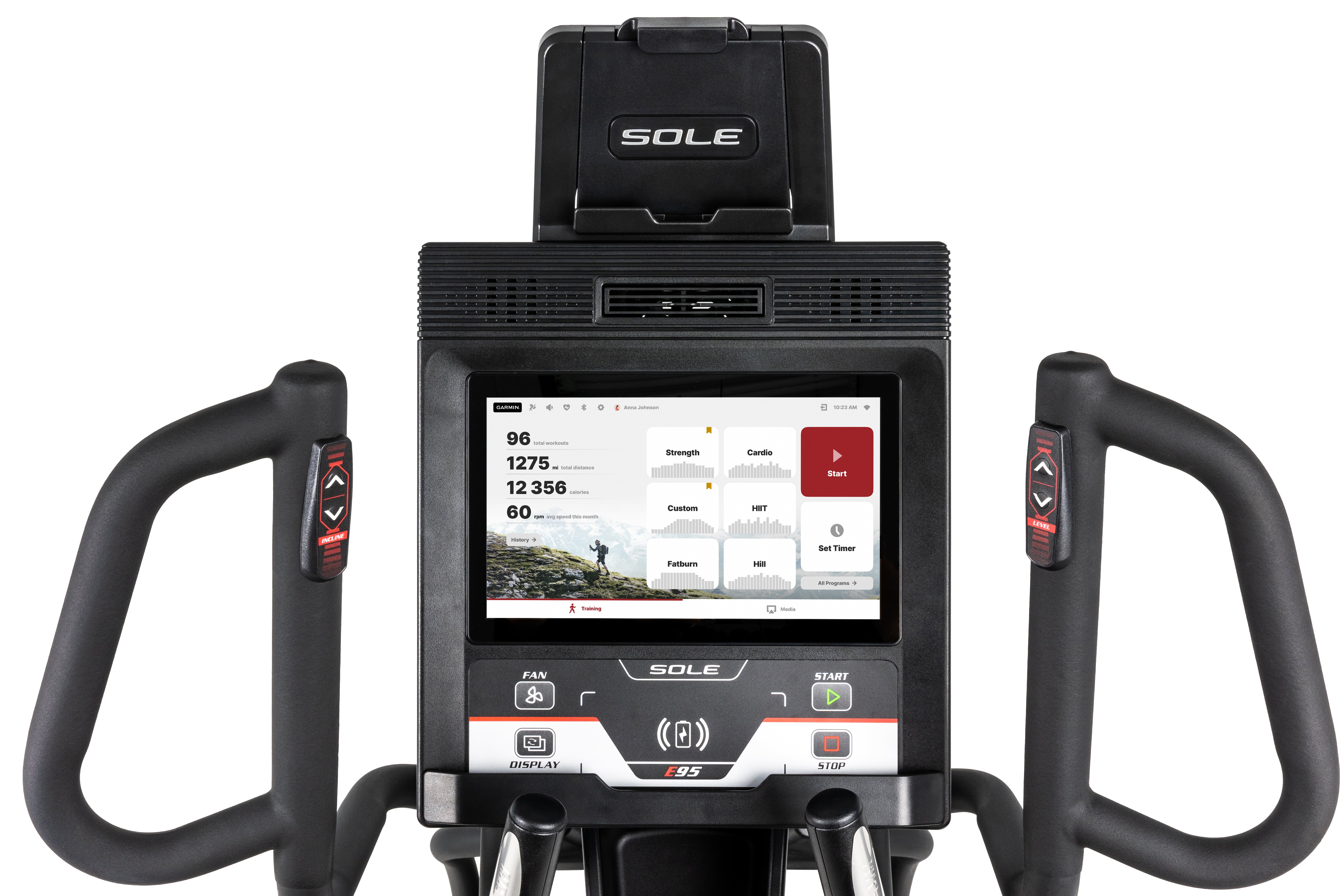 Close-up view of the Sole E95 elliptical trainer's console, highlighting its large touchscreen display with various workout metrics, buttons labeled 'FAN', 'DISPLAY', 'START', and 'STOP', and the 'SOLE' branding on the upper tablet holder and the 'E95' label on the lower console. The image also showcases the curved handlebars with heart rate sensors and control buttons.