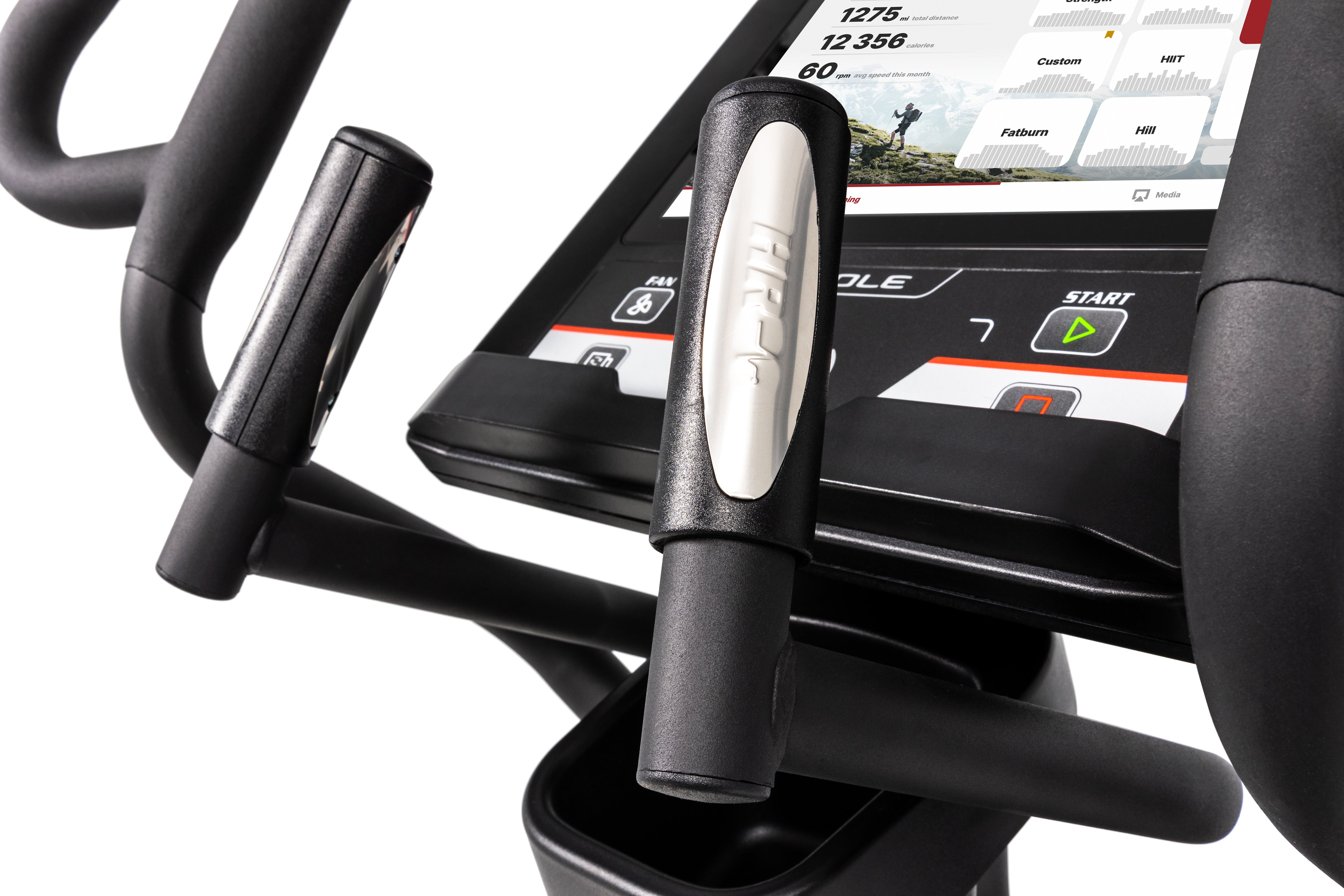Close-up of the Sole E95 elliptical trainer's console and handlebars. The digital console displays workout metrics such as heart rate, distance, and time. Handlebars feature ergonomic grips and control buttons. The overall color scheme is black with touches of gray and white.