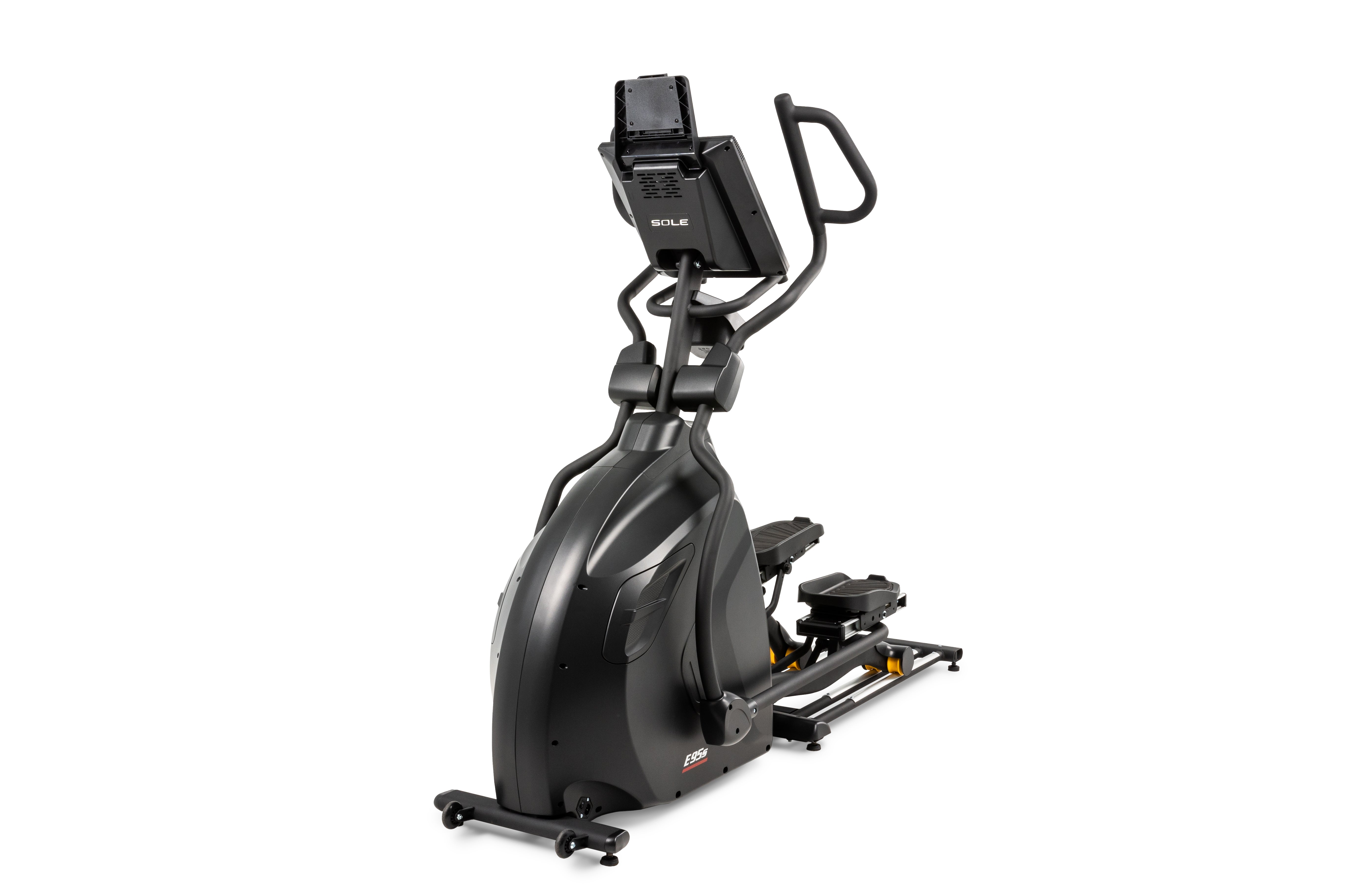 Side view of the Sole E95S elliptical machine in a matte grey finish, featuring a digital display with the SOLE logo, ergonomic handlebars, adjustable foot pedals, and a base with a yellow folding release lever and smooth-rolling wheels for easy movement.