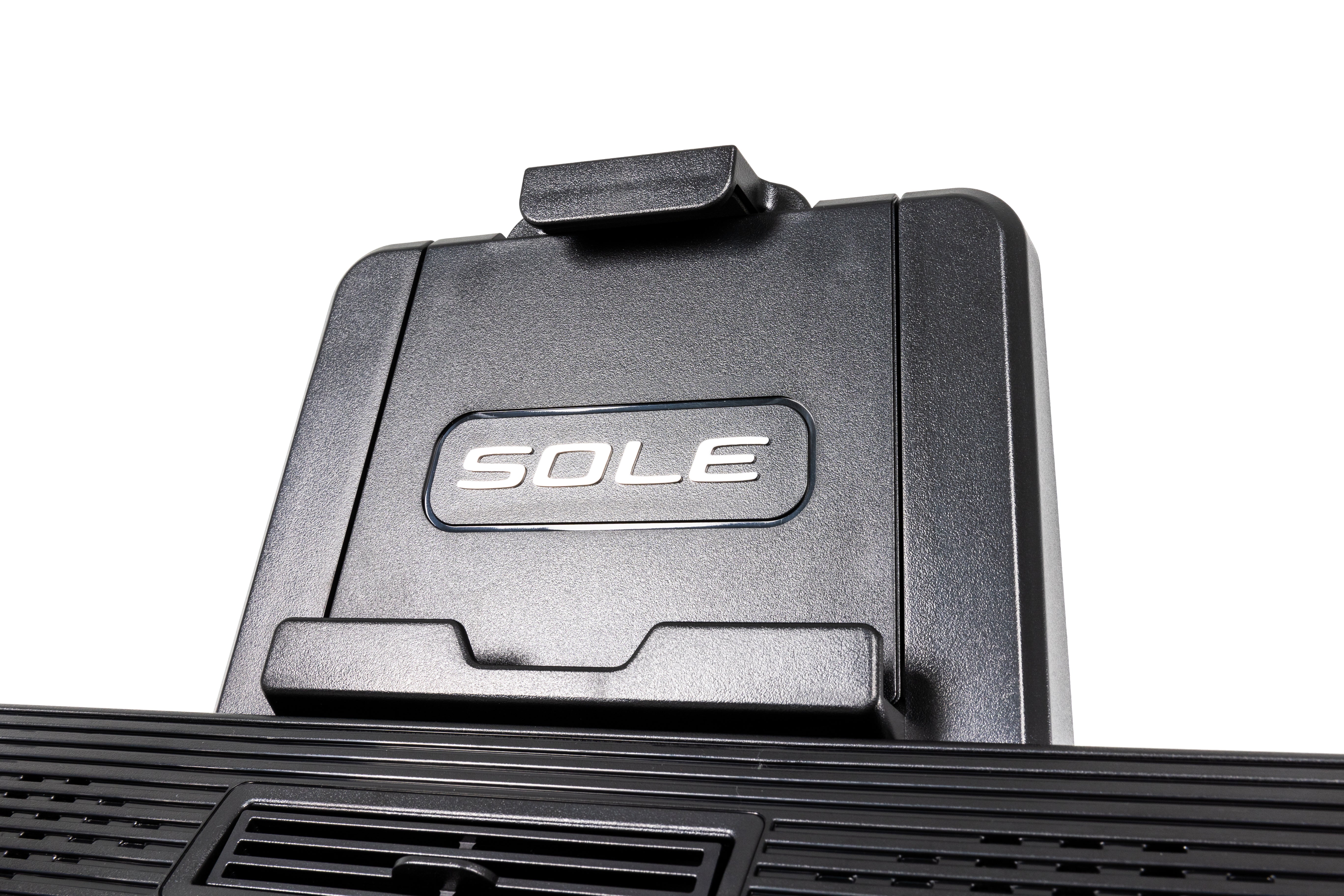 Detailed view of the Sole E95S elliptical machine's textured base with the embossed "SOLE" logo, showcasing its sturdy construction and vented design.