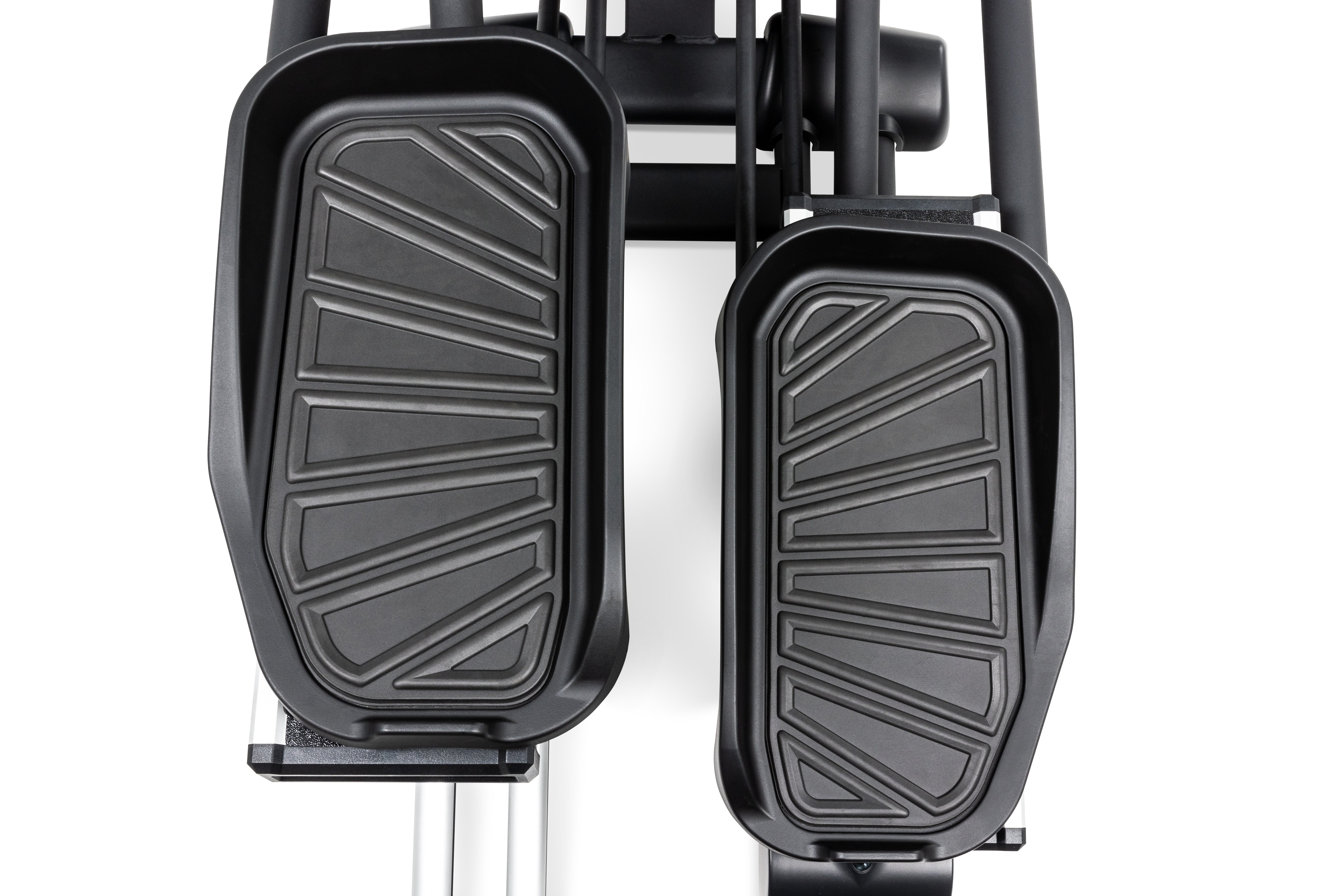 Close-up view of the textured foot pedals of the Sole E95S elliptical machine.