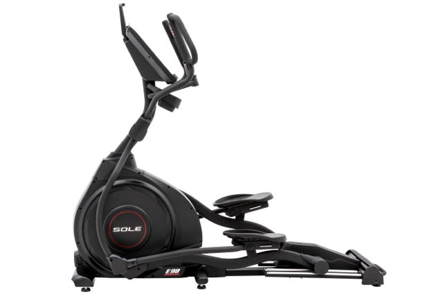 Side view of the Sole E98 elliptical trainer showcasing its digital display, foot pedals, and branding, on a white background.