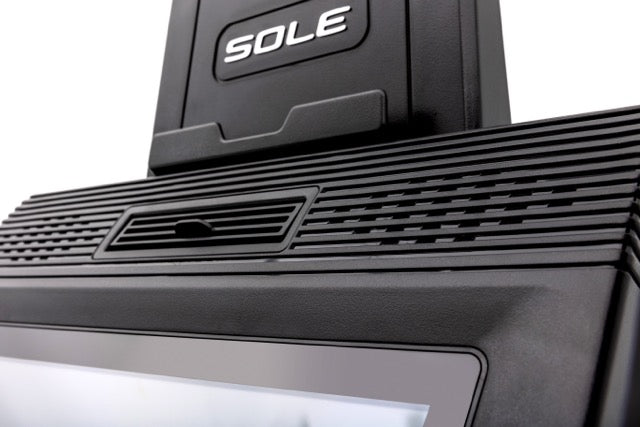 Close-up view of the black base of the Sole E98 machine, featuring the embossed "SOLE" logo and a textured footplate with a central vented area.