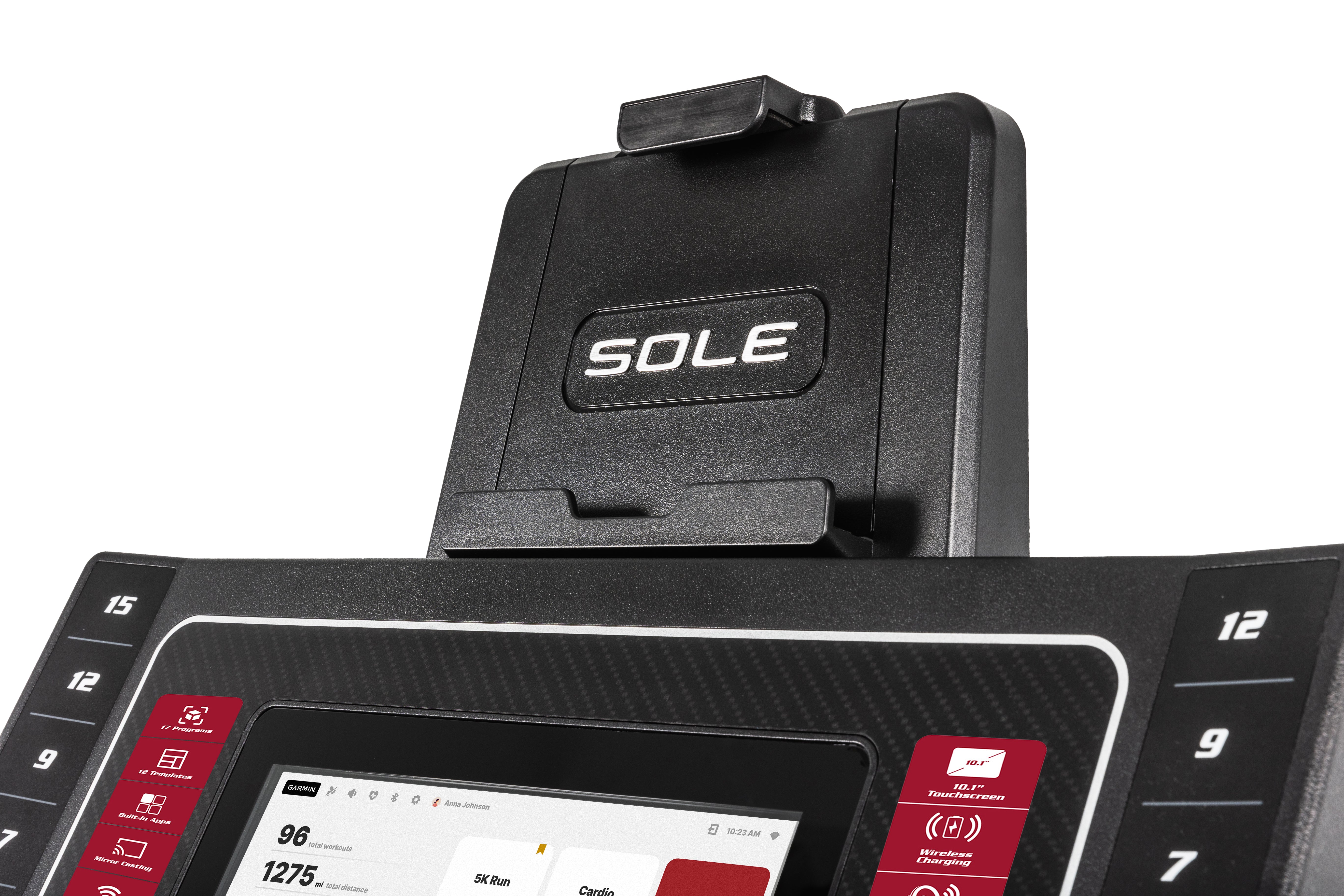 Detailed shot of the Sole F80 treadmill's upper console, showcasing the embossed 'SOLE' logo on the tablet holder, the digital touchscreen with workout stats, and side quick-control buttons for incline and speed settings