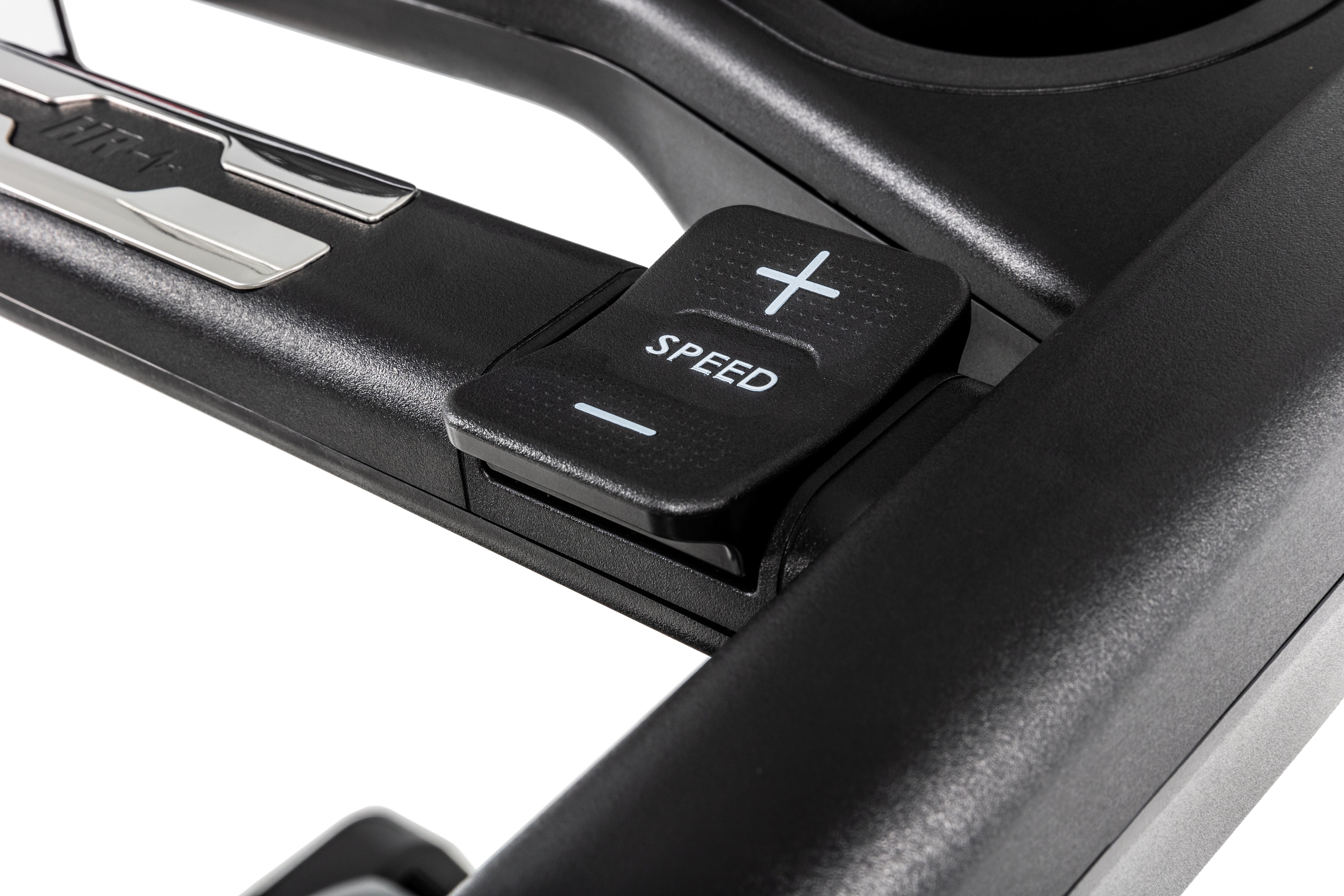 Detailed view of the Sole F80 treadmill's armrest, showcasing the 'SPEED' adjustment buttons with a '+' sign on top and a '-' sign below.