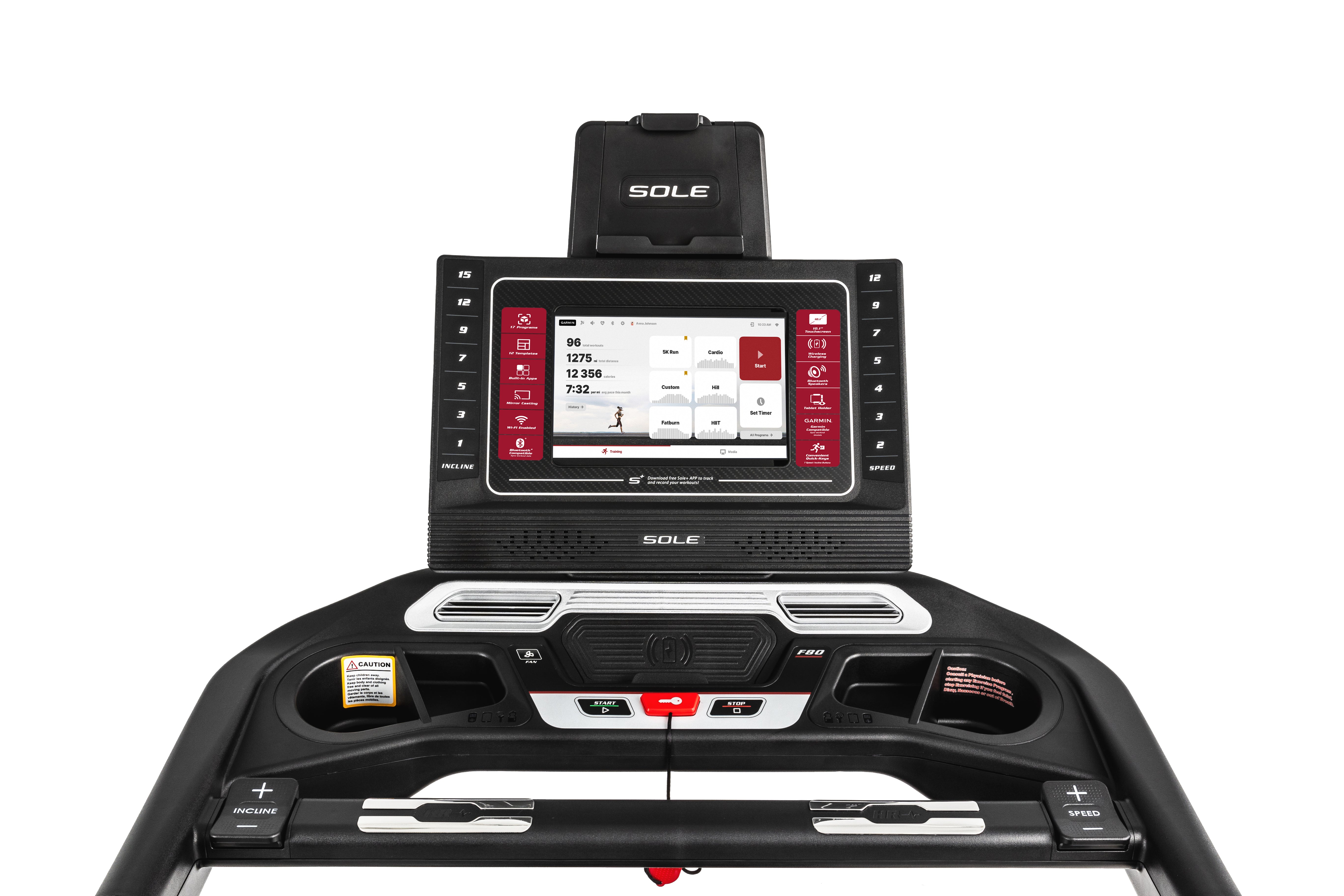 Front view of the Sole F80 treadmill's console featuring a large digital display with workout metrics, a tablet holder with the 'SOLE' branding, and user-friendly control buttons for speed and incline adjustments.