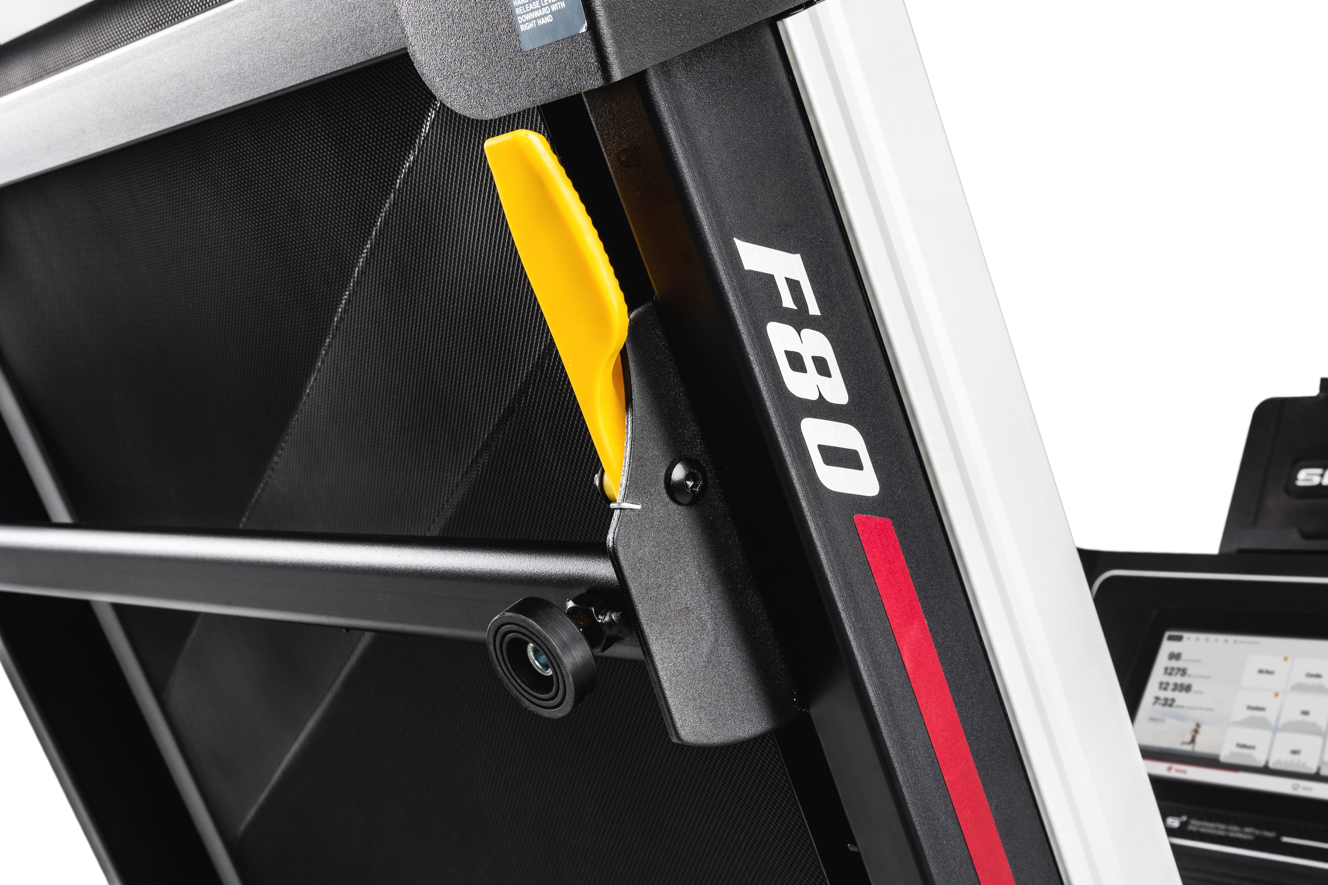 Close-up view of the Sole F80 treadmill's side, showcasing the textured black side panel with 'F80' branding, a yellow release handle, and a stabilizer at the base.