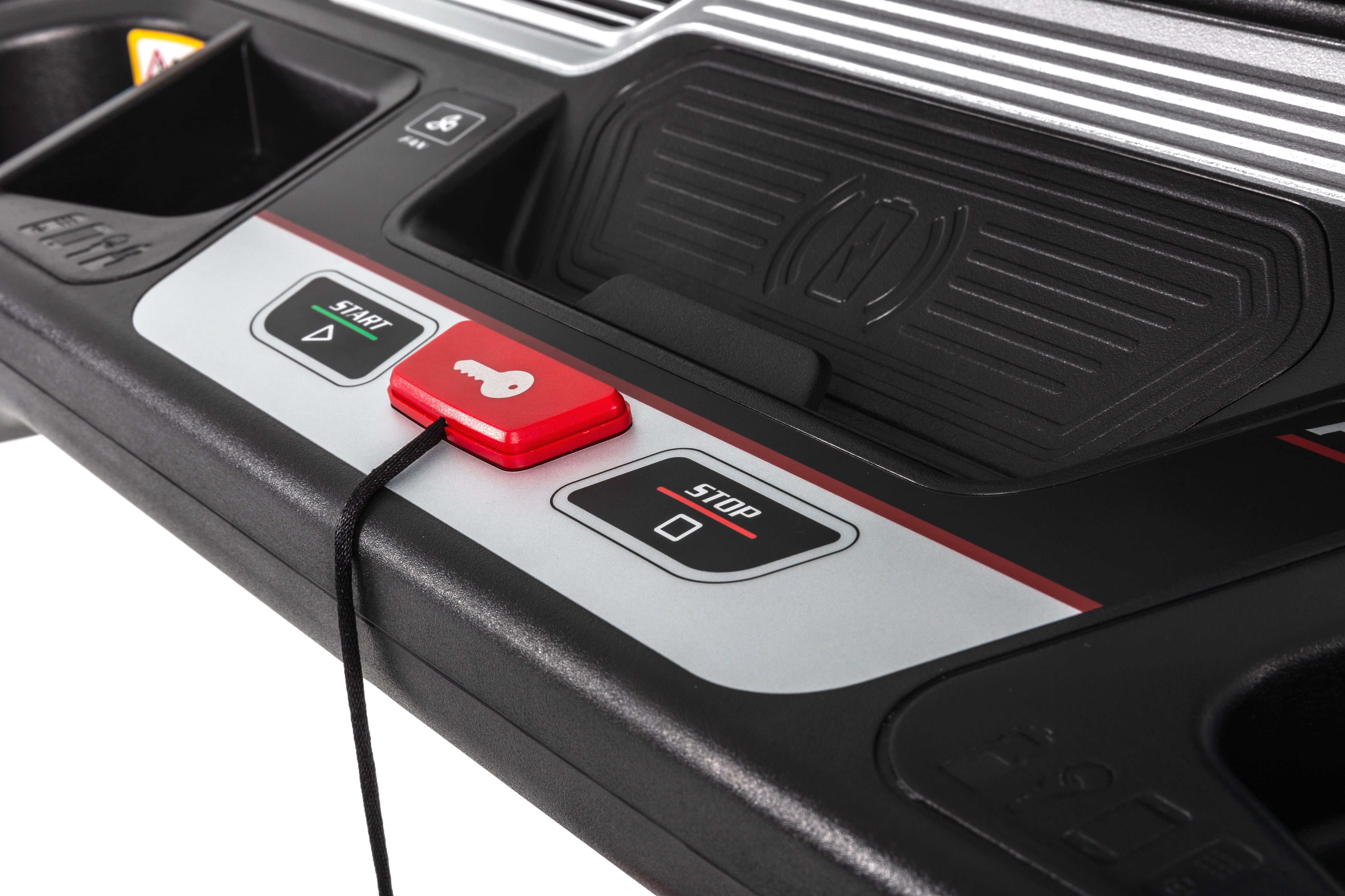 Close-up of the Sole F85 treadmill's central console area, showcasing the wireless charging pad with a circular logo, air vents, a red "Start" button, a black "Stop" button, and the F85 model label on the side.