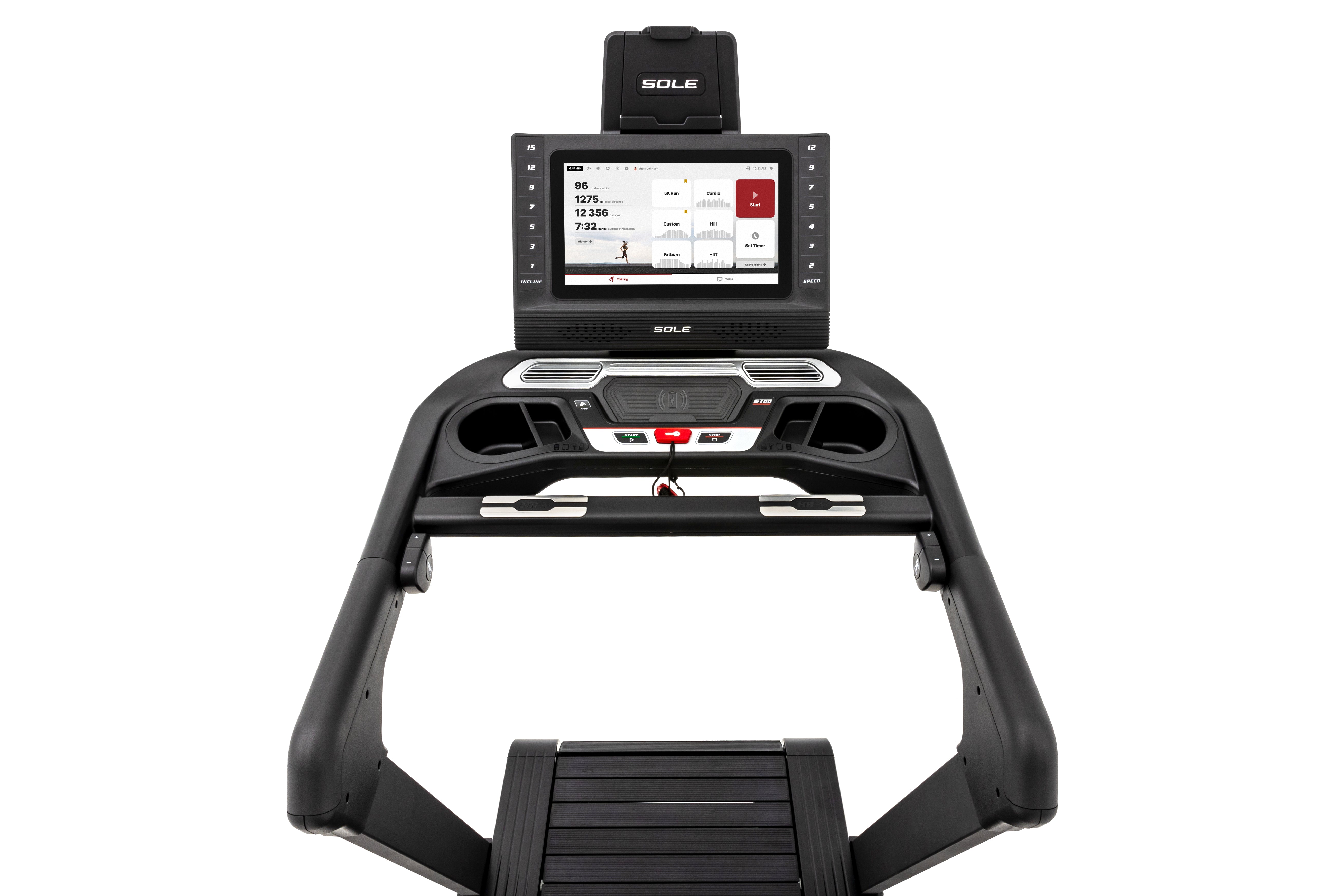 Front and overhead perspective of the Sole ST90 treadmill, showcasing its digital display with workout metrics, control panel, handrails, and a portion of the tread platform, set against a white background.