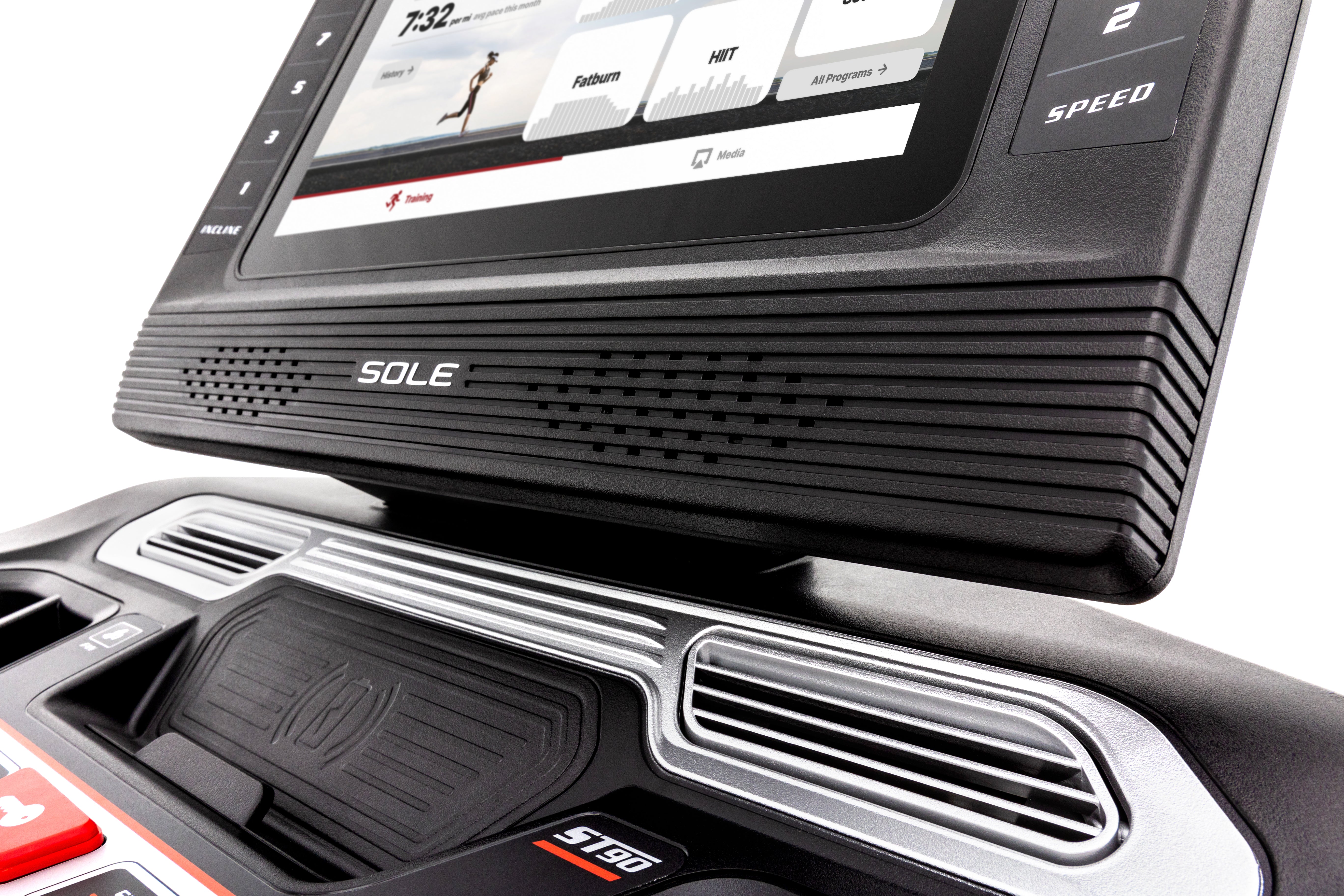 Angled view of the Sole ST90 treadmill's control panel, featuring a digital screen displaying a running feedback, tactile start and stop buttons, cup holders, and the safety key attachment on a sleek black design with silver accents.