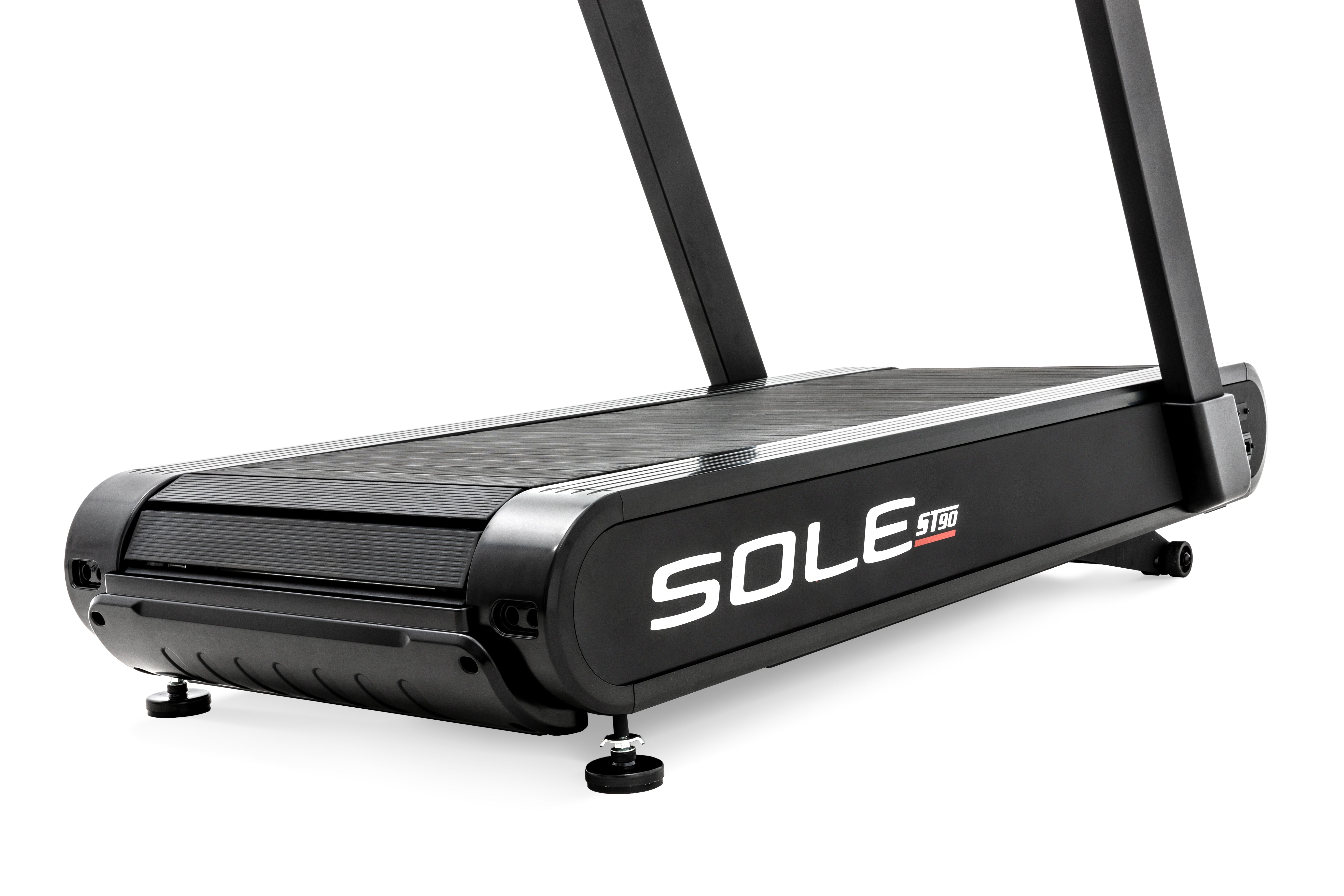 Side profile of the Sole ST90 treadmill, displaying its sleek black design, running belt, prominent SOLE ST90 branding, and sturdy handrails.