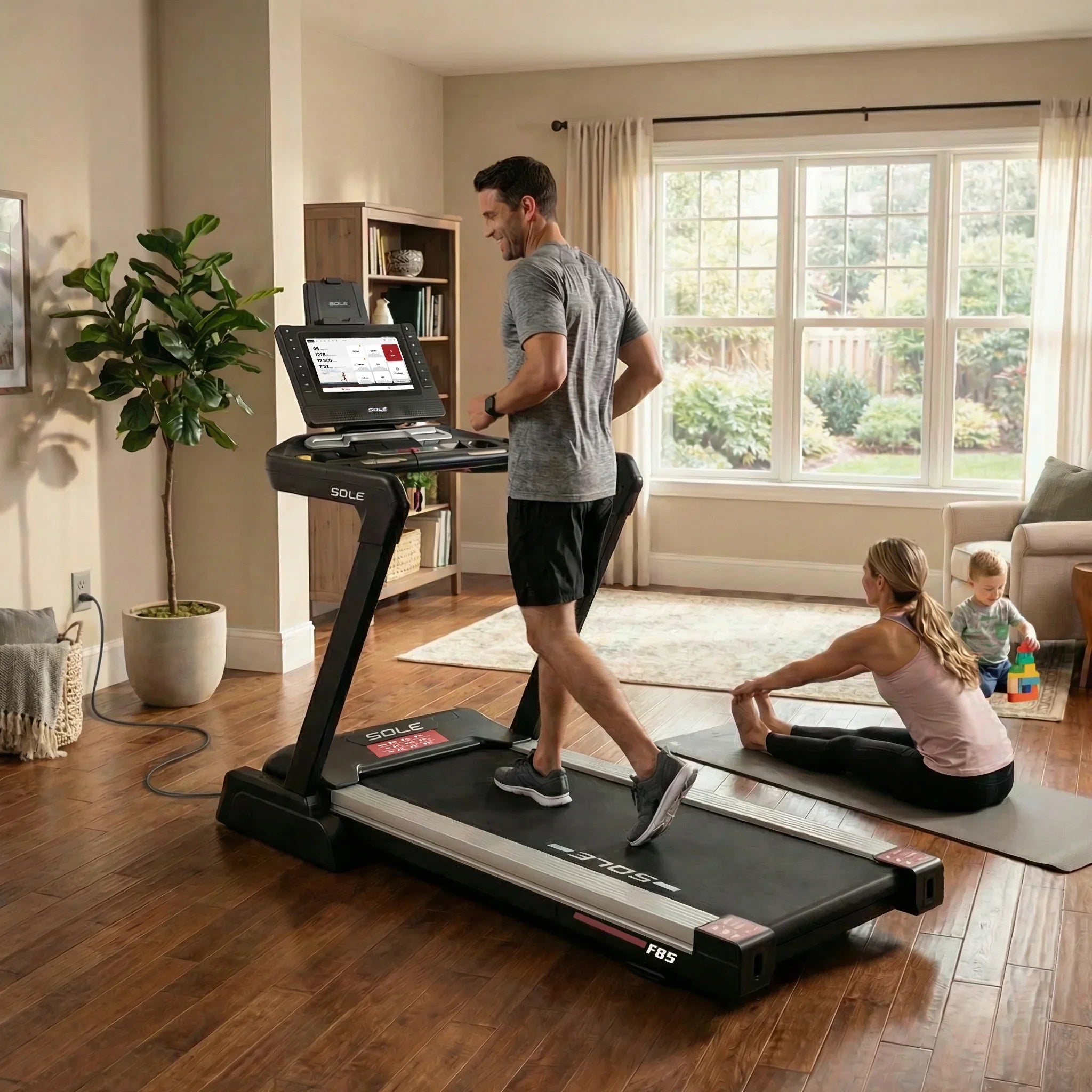 Couple using SOLE F85 treadmill at home — built for the whole family