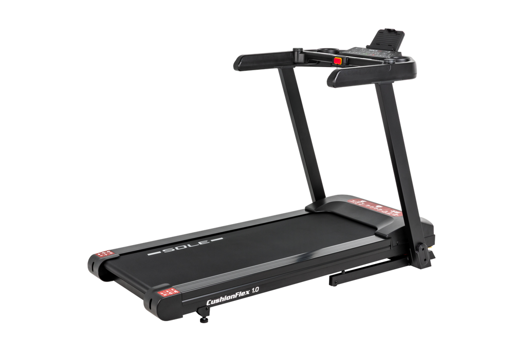 SOLE F50 treadmill in a three-quarter studio view from the rear left, the cushioned deck running toward the camera and the console above the front uprights